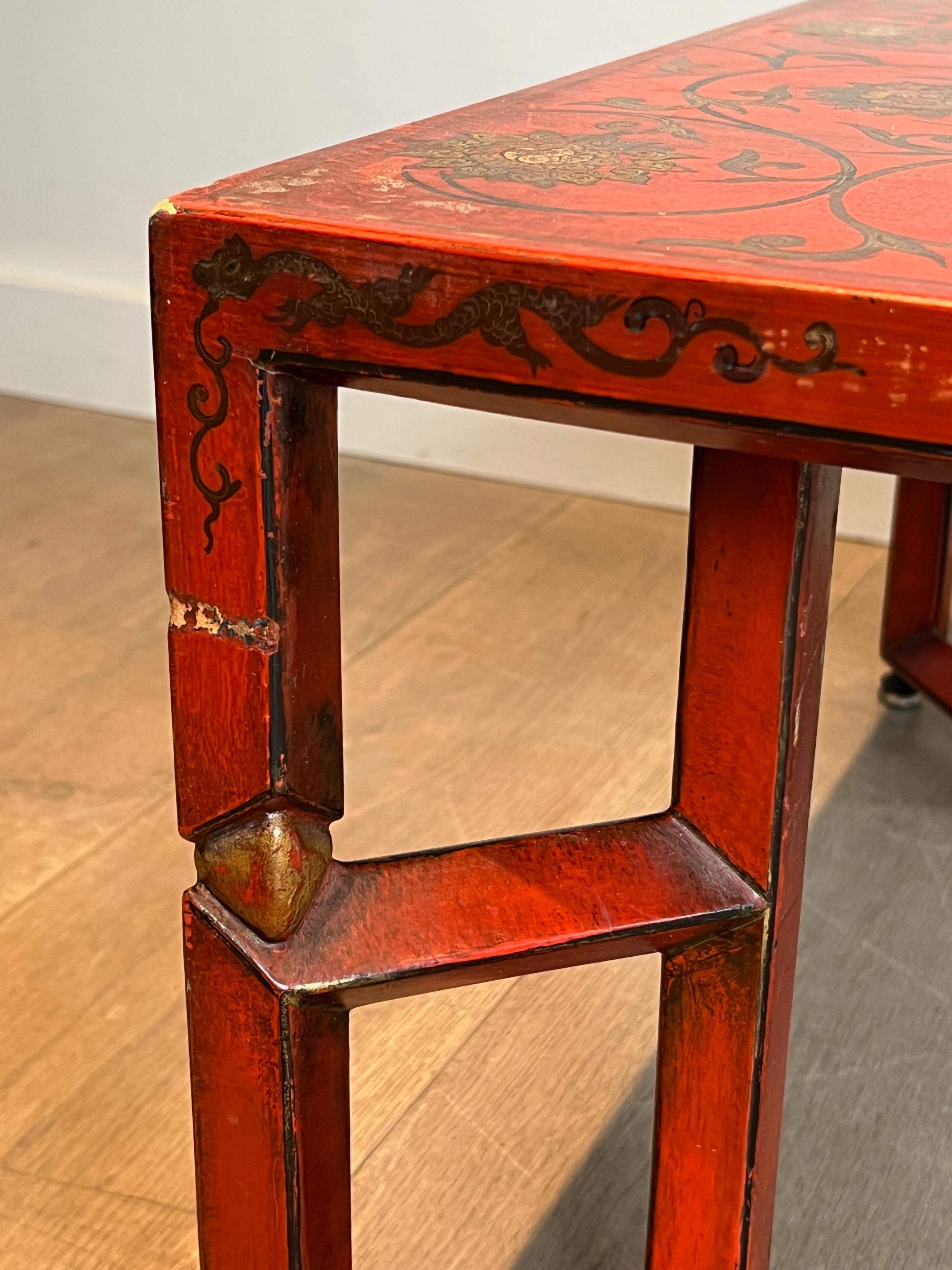 Late 20th Century Large Red Lacquered Coffee Table with Gold Chinese Decorations For Sale