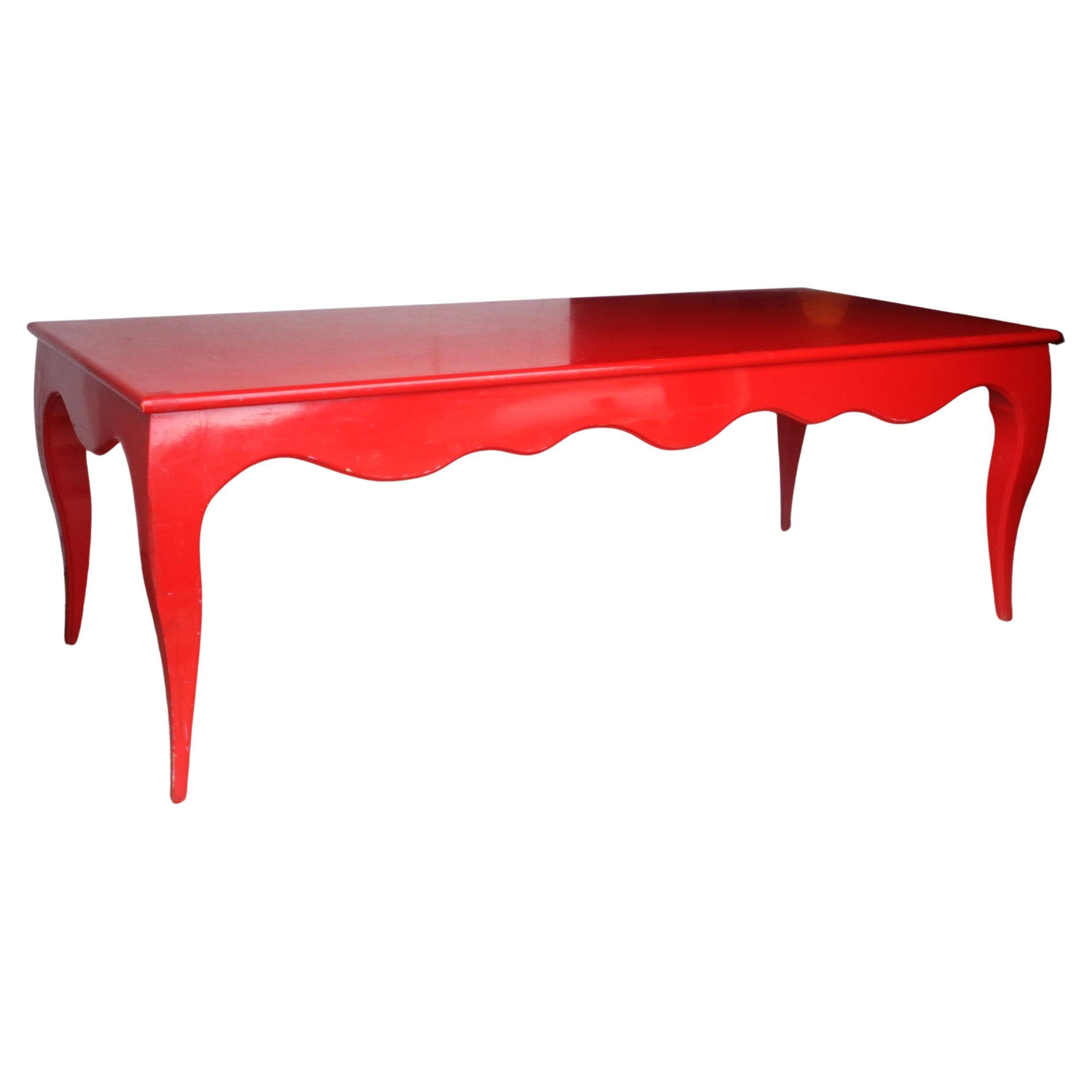 Original red lacquered table w/ wave like scalloped apron on all four sides and  curved cabriole legs. In the modernist style of Jean-Michel Frank. Exceptionally beautiful. Use as kitchen island / library table / serving table / store display table