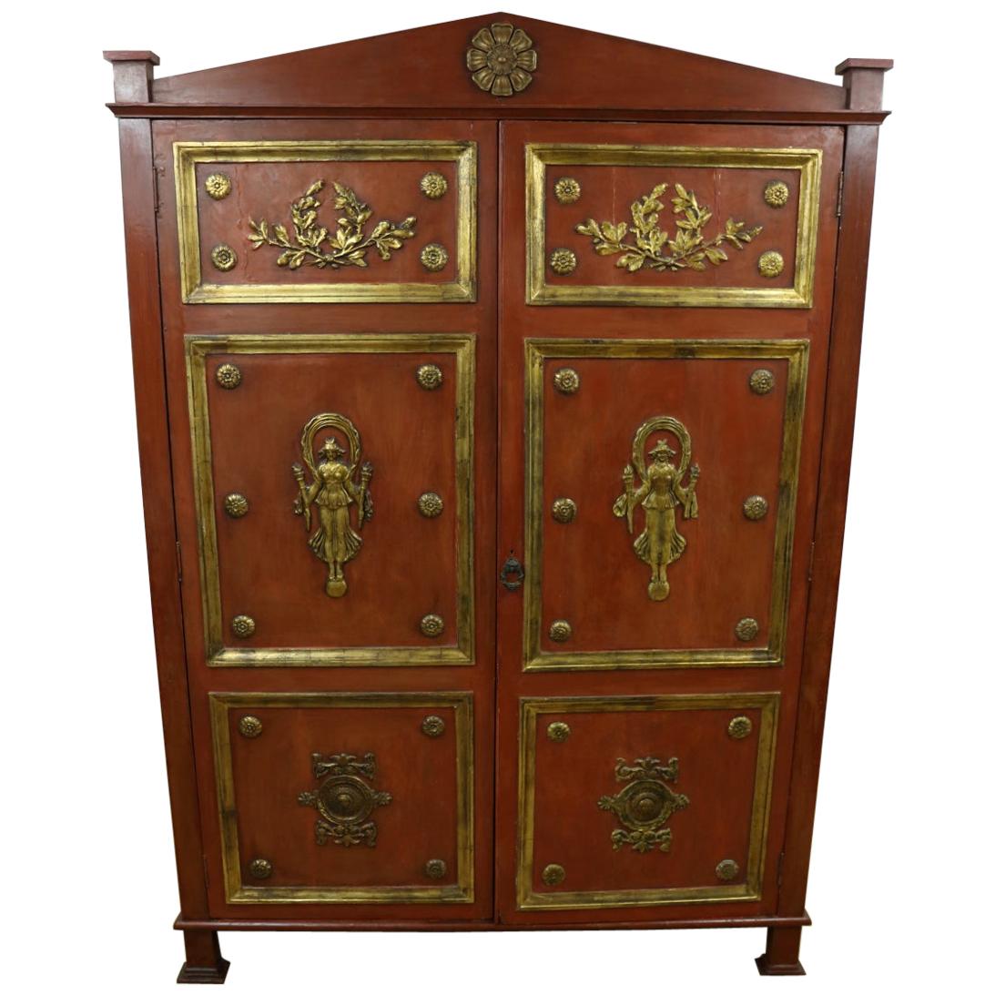 Large Red Lacquered wardrobe with gilded figures in relief For Sale