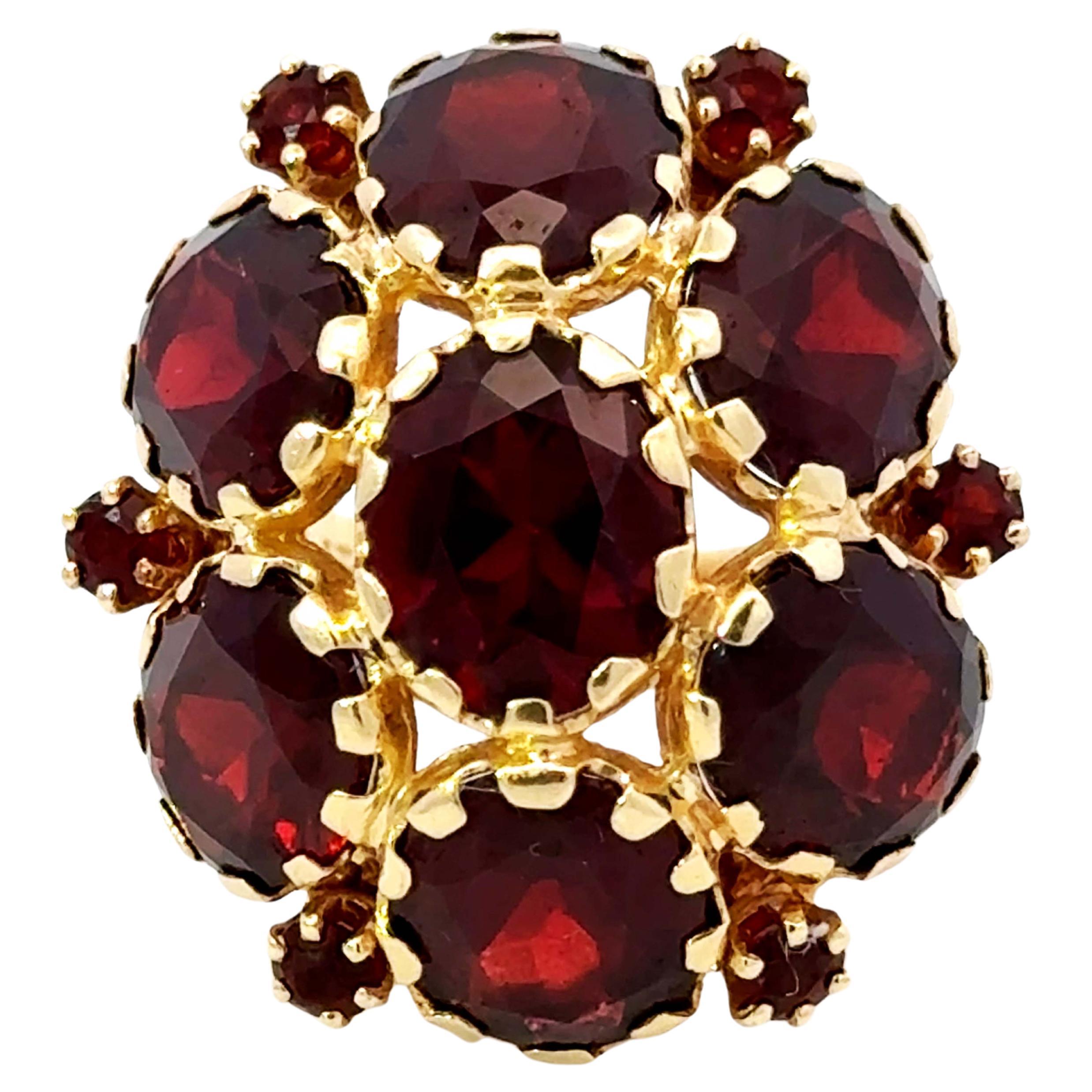 Grande bague cocktail fleur en or jaune 14 carats avec grenats ovales rouges