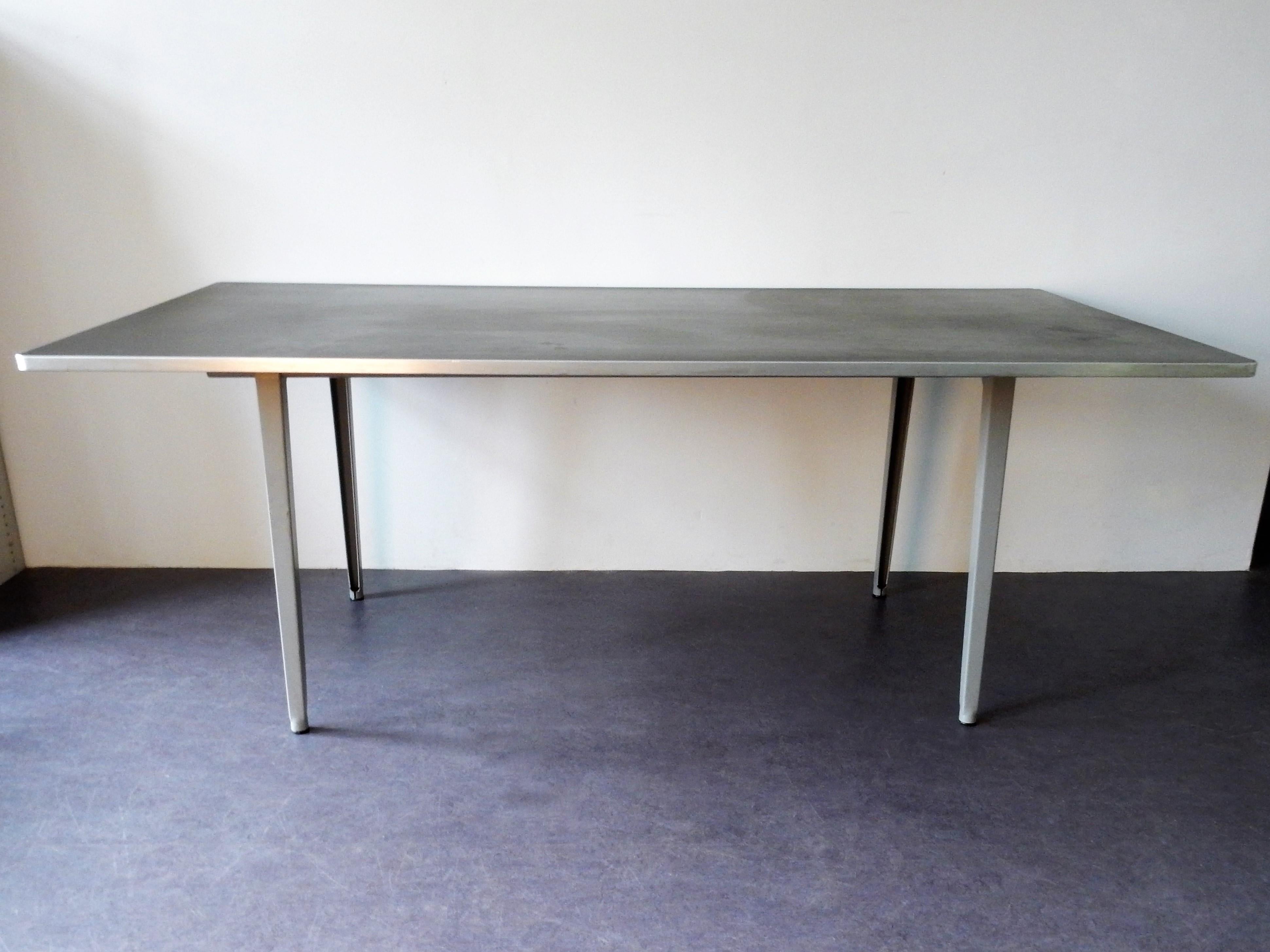 The famous 'Reform' table was designed by Friso Kramer for Ahrend de Cirkel in 1955. This table is a true Dutch design in a very nice condition. At the mark on the solid metal frame you can see it was specially made for delft University of