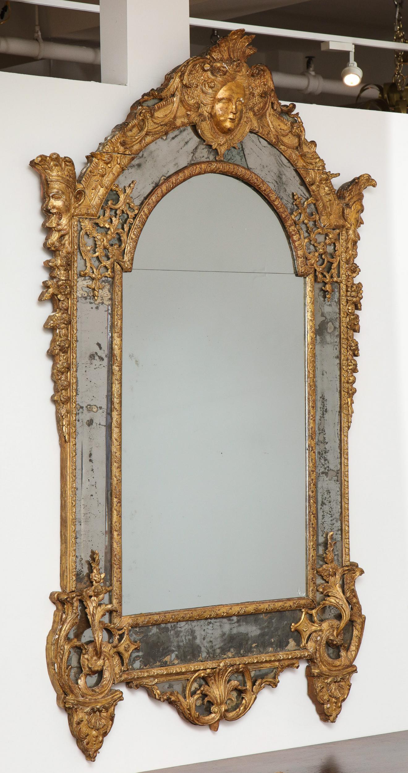 French Large Régence Carved Giltwood Wall Mirror For Sale