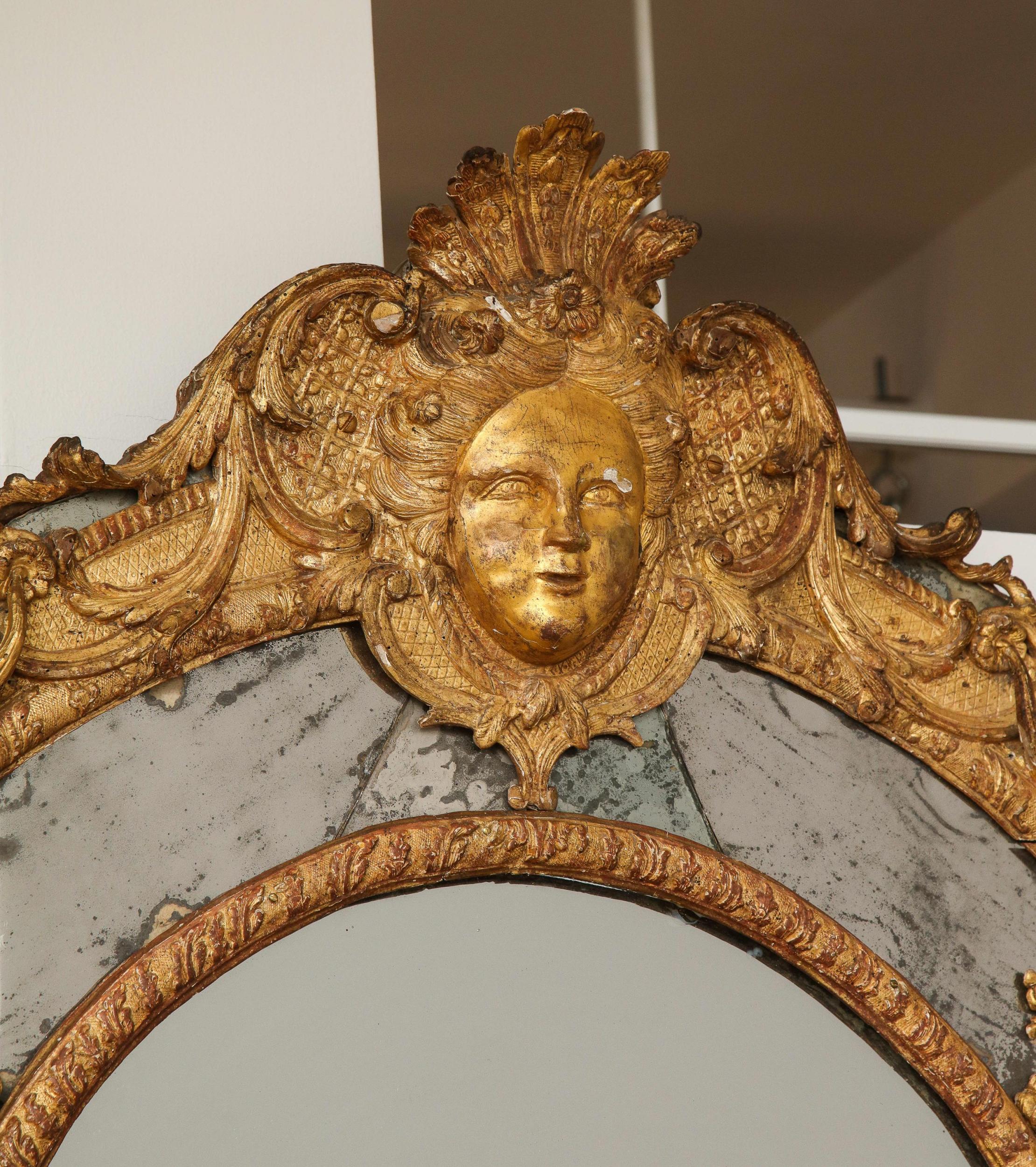 Early 18th Century Large Régence Carved Giltwood Wall Mirror For Sale