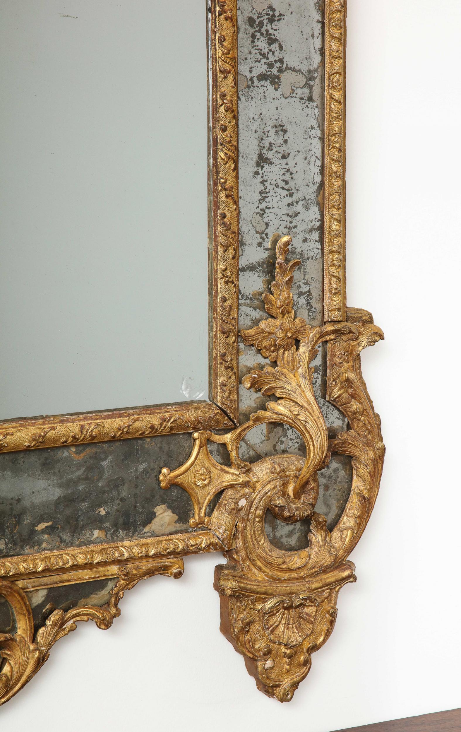 Mercury Glass Large Régence Carved Giltwood Wall Mirror For Sale