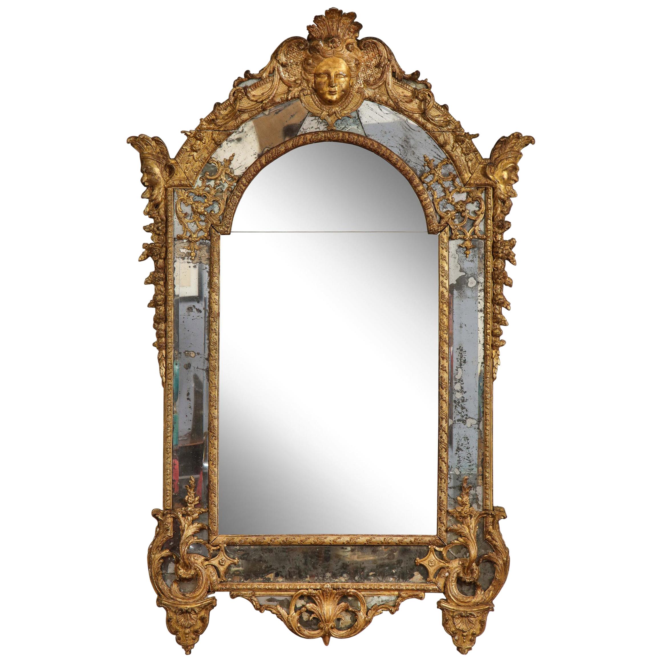 Large Régence Carved Giltwood Wall Mirror For Sale