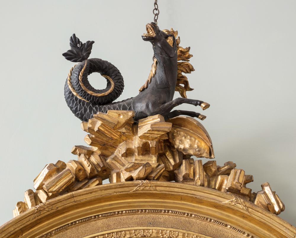 Surmounted by shell and Hippocampus cresting, retaining original convex plate and gilding.

Additional information:
Dimension: Height: 170 cm, 66 7/8″
Width: 102 cm, 40 1/8″
Depth: 19 cm, 7 1/2″