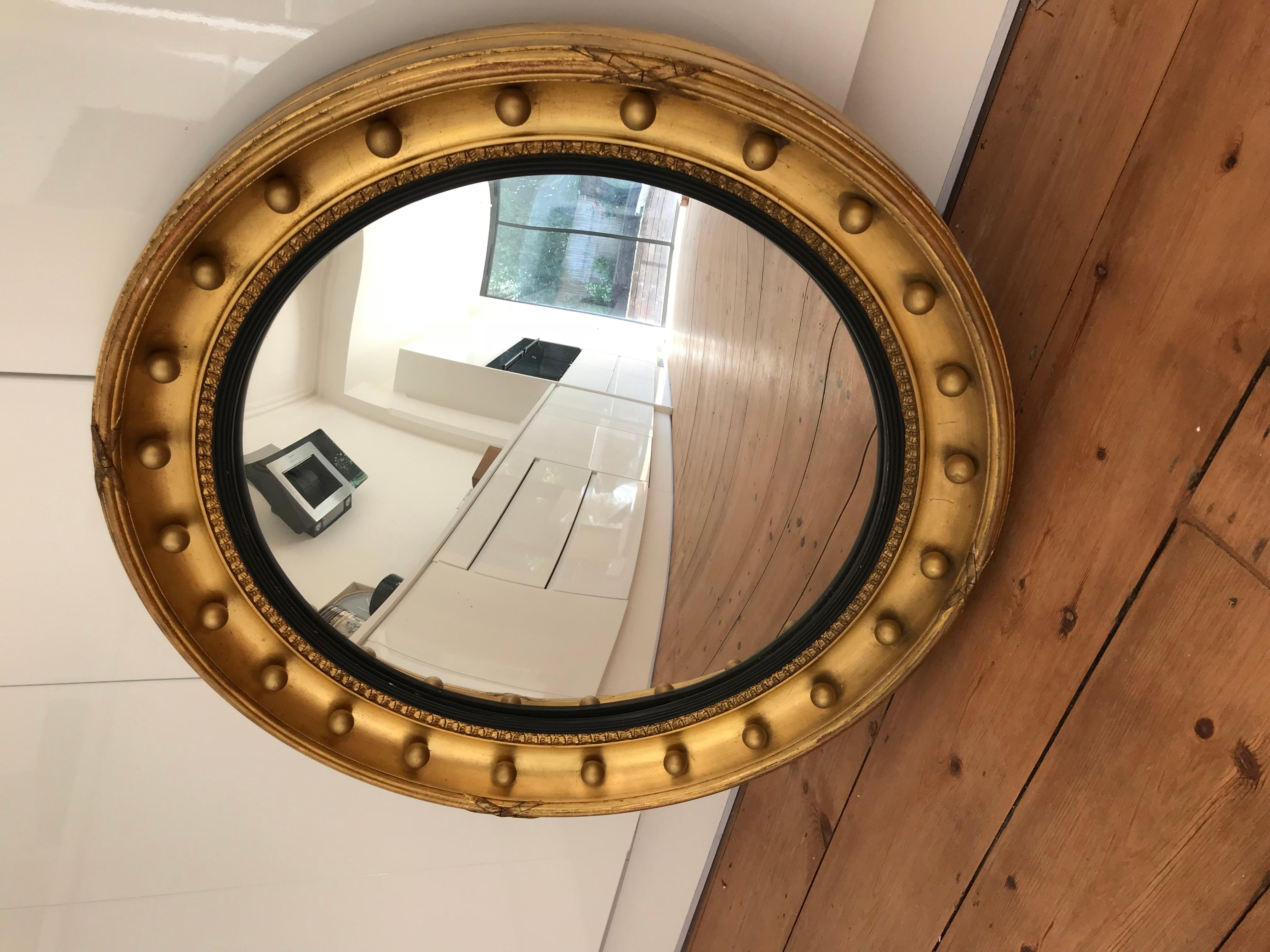 Large Regency style convex bullseye or butler's mirror.