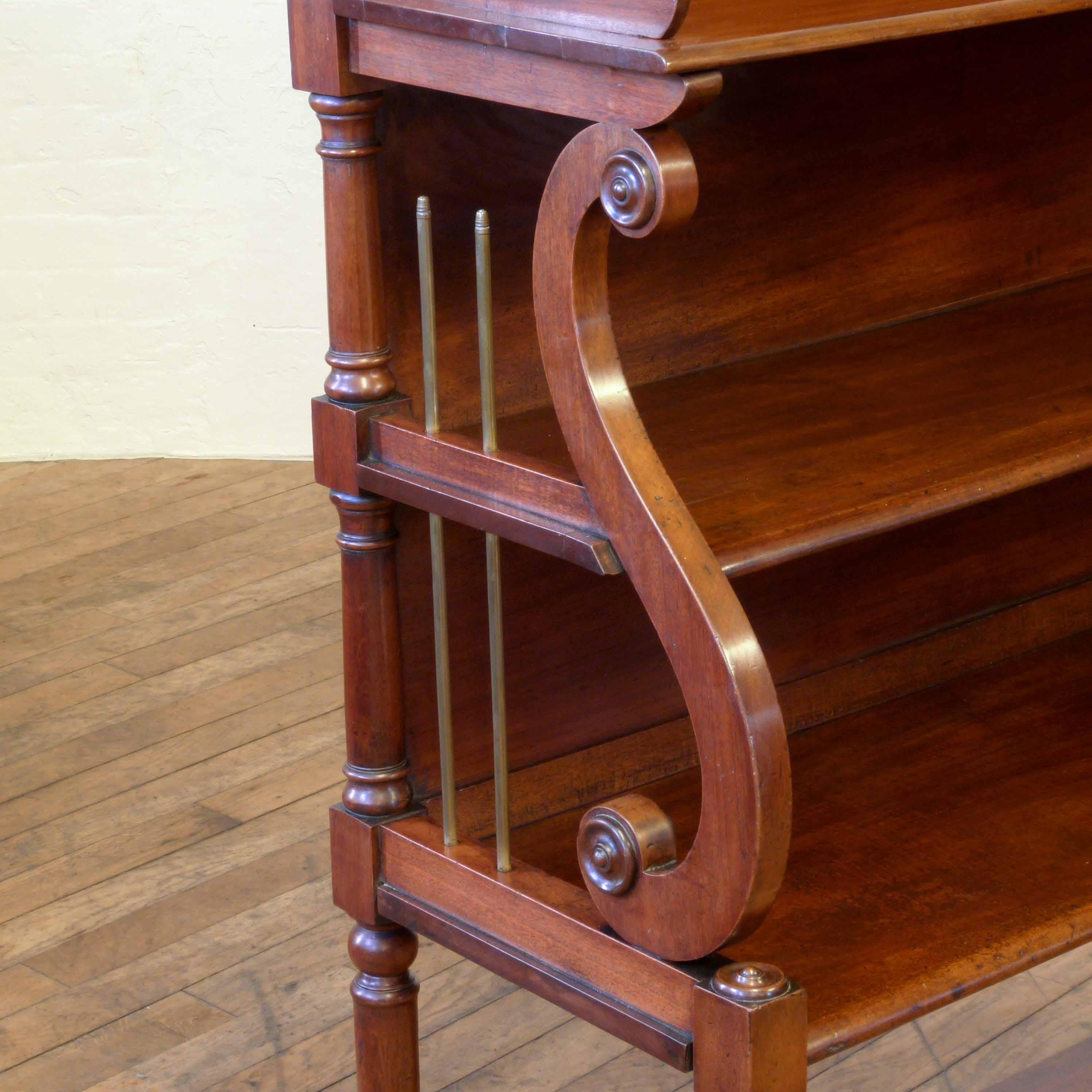 Beautiful Regency mahogany whatnot of large proportions. With turned legs supporting a low undershelf below three stepped shelves with superb lyre ends and inserted brass rods to look like strings. The top has a wonderfully shaped gallery set with