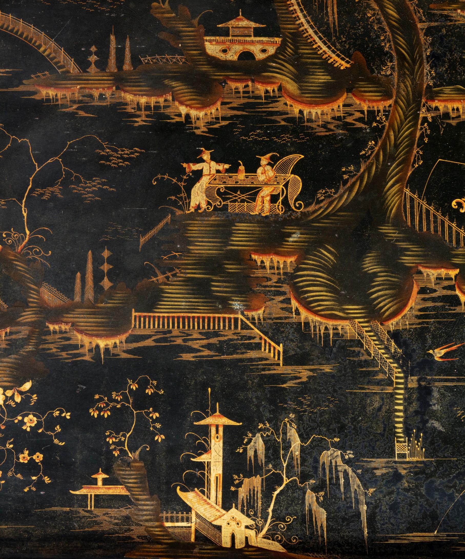A large Regency period Chinese export lacquer tray; the tray decorated with a mythical Chinese garden landscape filled with pagodas;railings and fishermen.