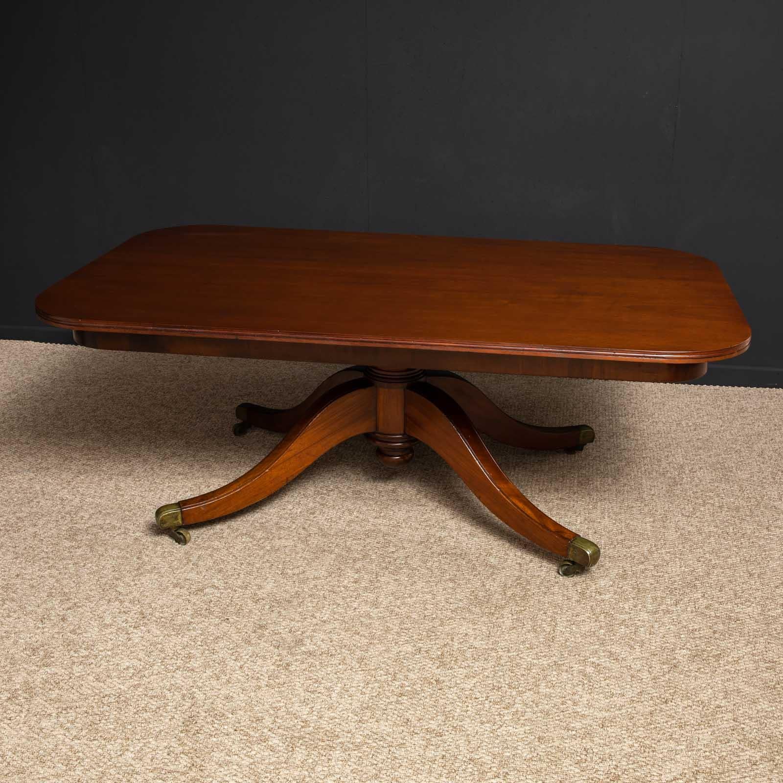 An unusually large Regency Revival mahogany table of elegant form. The splayed legs are very sturdy and still retain the original brass castors. There has been some veneer repairs to the underside, but they are not very visible. This table will