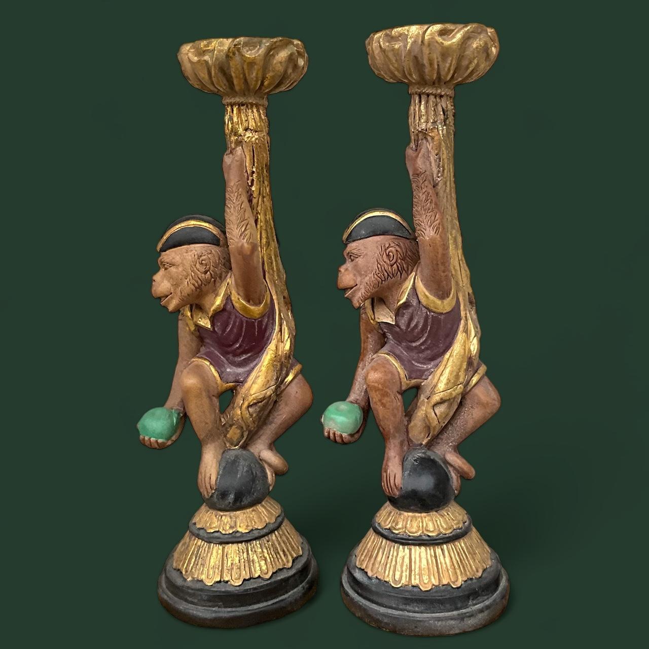 This is a fun pair of regency style gilt monkey form holiday candlesticks attributed to Maitland - Smith. They are in very good condition.