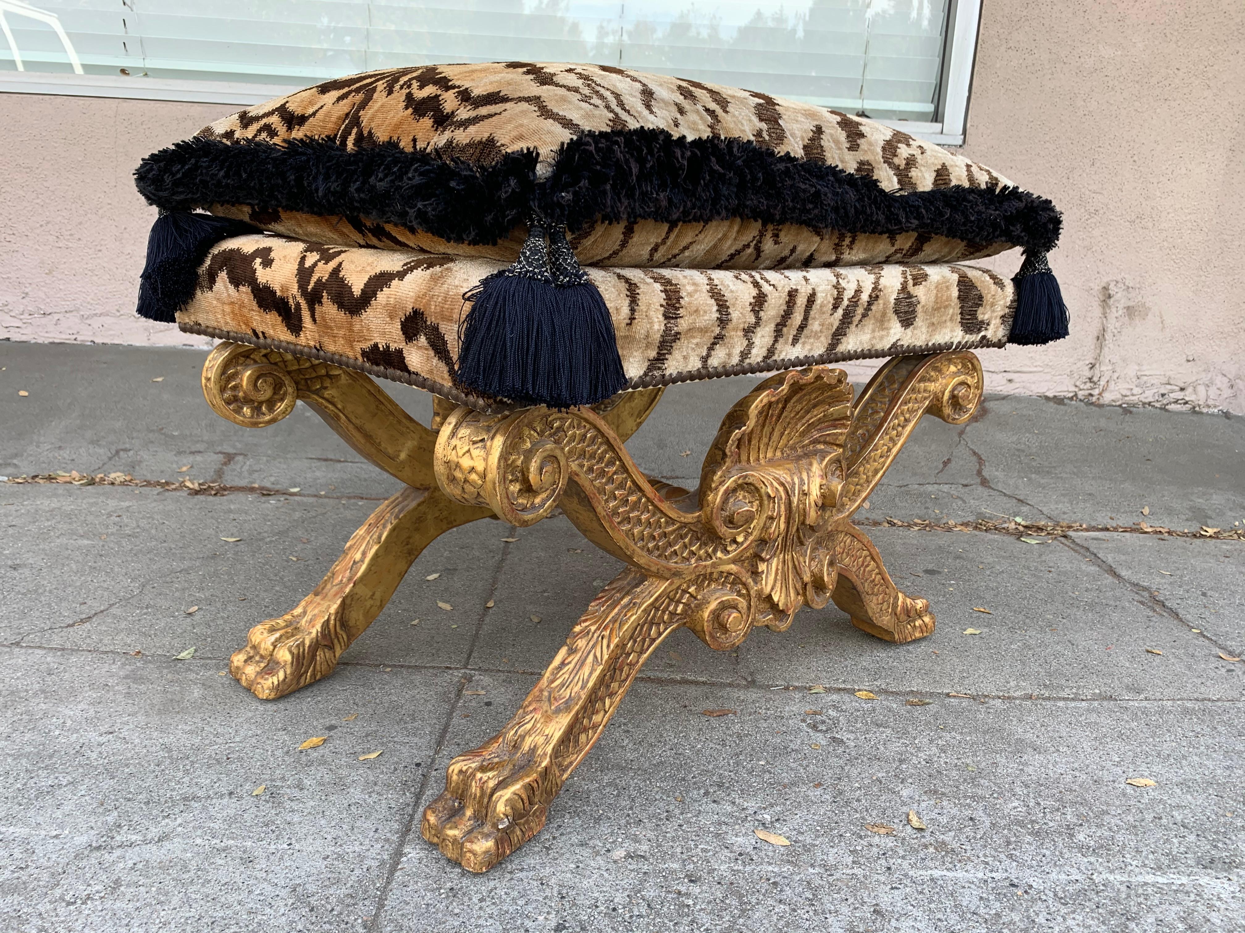 Beautiful Regency style giltwood bench designed by Charles Pollock, excellent condition upholstered in an Indian silk fabric, very good vintage condition.
Measures: 29” wide x 19” deep x 23” high to top of pillow x 17” high to top of seat.