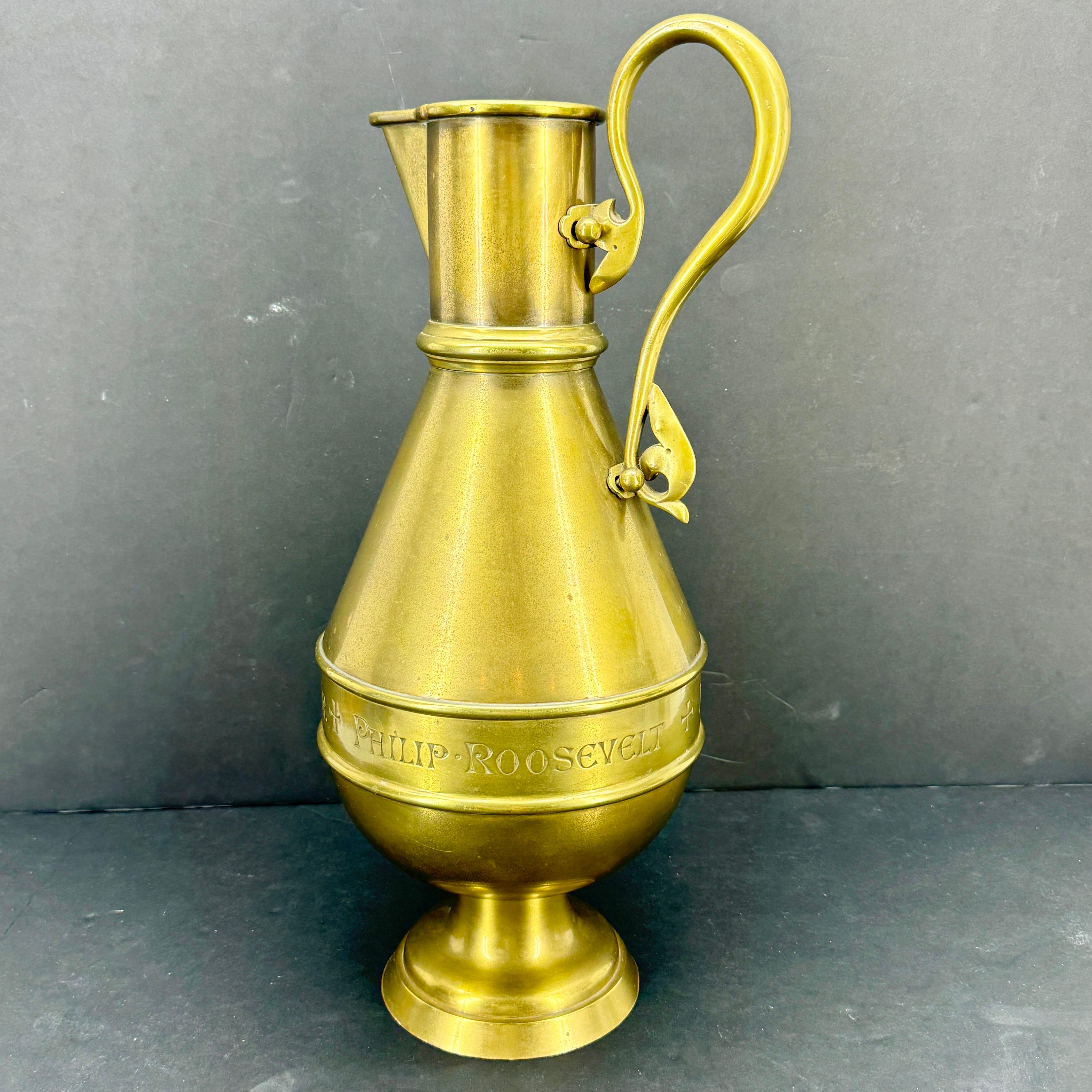Substantial Gothic Revival brass jug marked with names Margaret, Philip and Roosevelt as well as maker J&R Lamb New York.  Certainly religious in nature with the cross inscribed around the center. Fantastic piece to add to an existing collection on