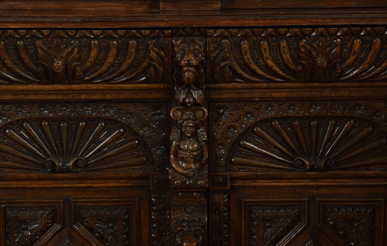 Large Renaissance Revival Carved Oak Three-Door Bookcase 1