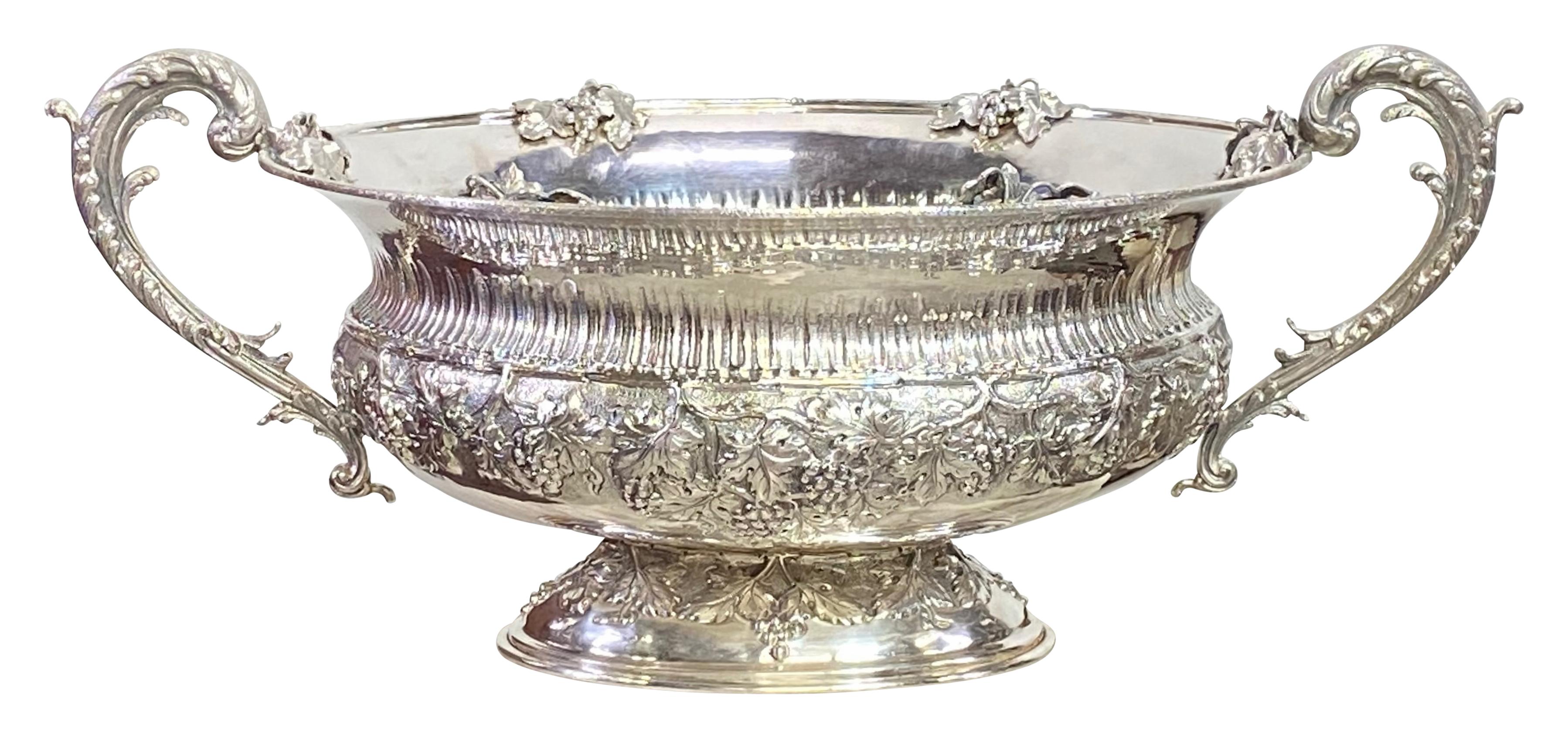 Beautiful quality and impressive hand repousse and chased sterling silver two handled wine cooler with grapevine design motif. Perfect to chill multiple bottles of wine.
Marked on the bottom V & B 925 and another mark that I cannot make out. I was
