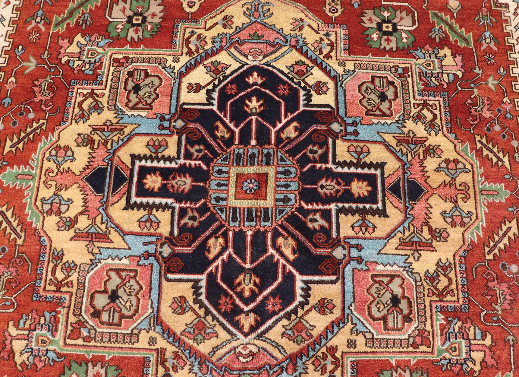 very Large Serapi-Heriz Design rug with Geometric Medallion 

Measures: 12'1 x 18'2

Large Beautiful modern Heriz Style hand-knotted wool rug with a Traditional Design. This Heriz rug has a multi-color accent in a gorgeous medallion geometric floral