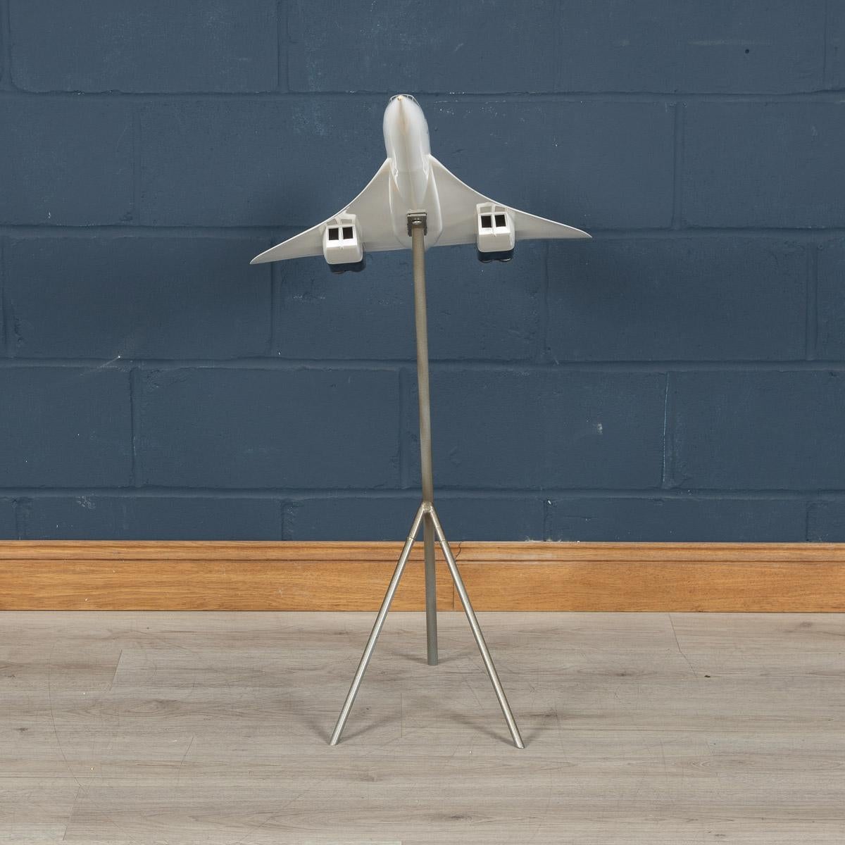A splendid vintage fibreglass and plastic composite model of a Concorde in full British Airways livery mounted on a tripod stand by Space Models, circa 1990. This 1:72 scale aircraft model was presented to one of BA's top travel agents to use for