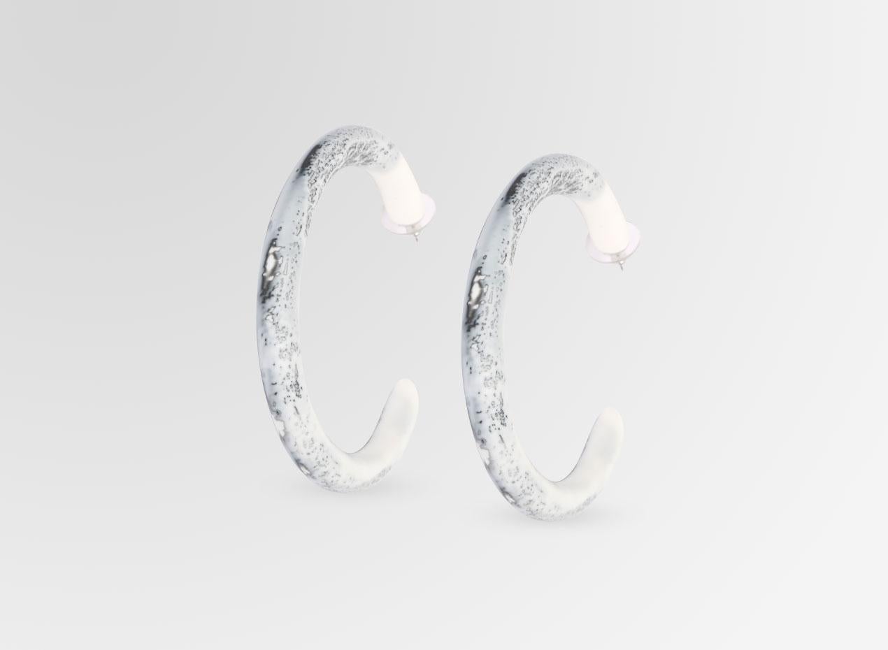 Resin hoop earrings with surgical steel studs. These earrings are featured in our Classic colour, White Marble. 

Dinosaur Designs resin products are hand made in Sydney, Australia. Each piece is unique and we cannot guarantee you will receive an