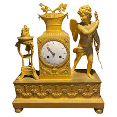 Large Restoration period clock in chiseled and gilded bronze