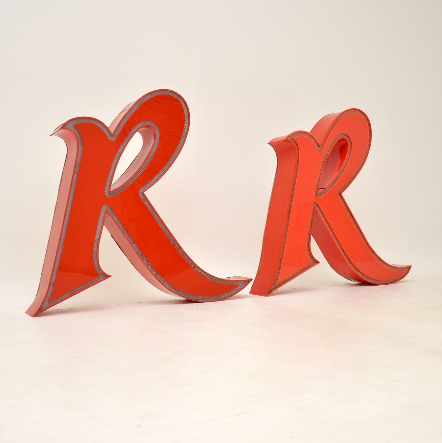 A wonderful pair of vintage large American diner lights shaped as the letter R. This date from around the 1950-60’s.

They have been fitted with LED lights by the previous owner, and each has an AC adapter plug and cable which powers them. they