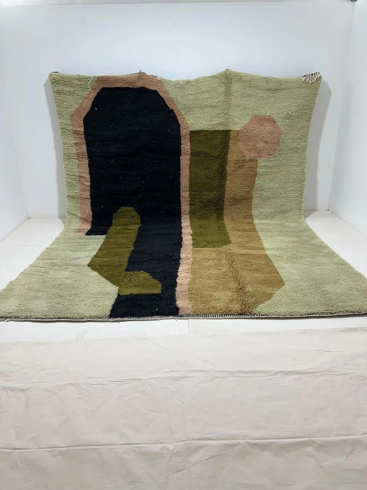 This large, funky handwoven Moroccan rug was made by hand by skilled artisans in the Atlas Mountains using the highest quality M'Rirt wool. It is impressive in both size and design, and is the perfect luxury statement piece for any room. The design