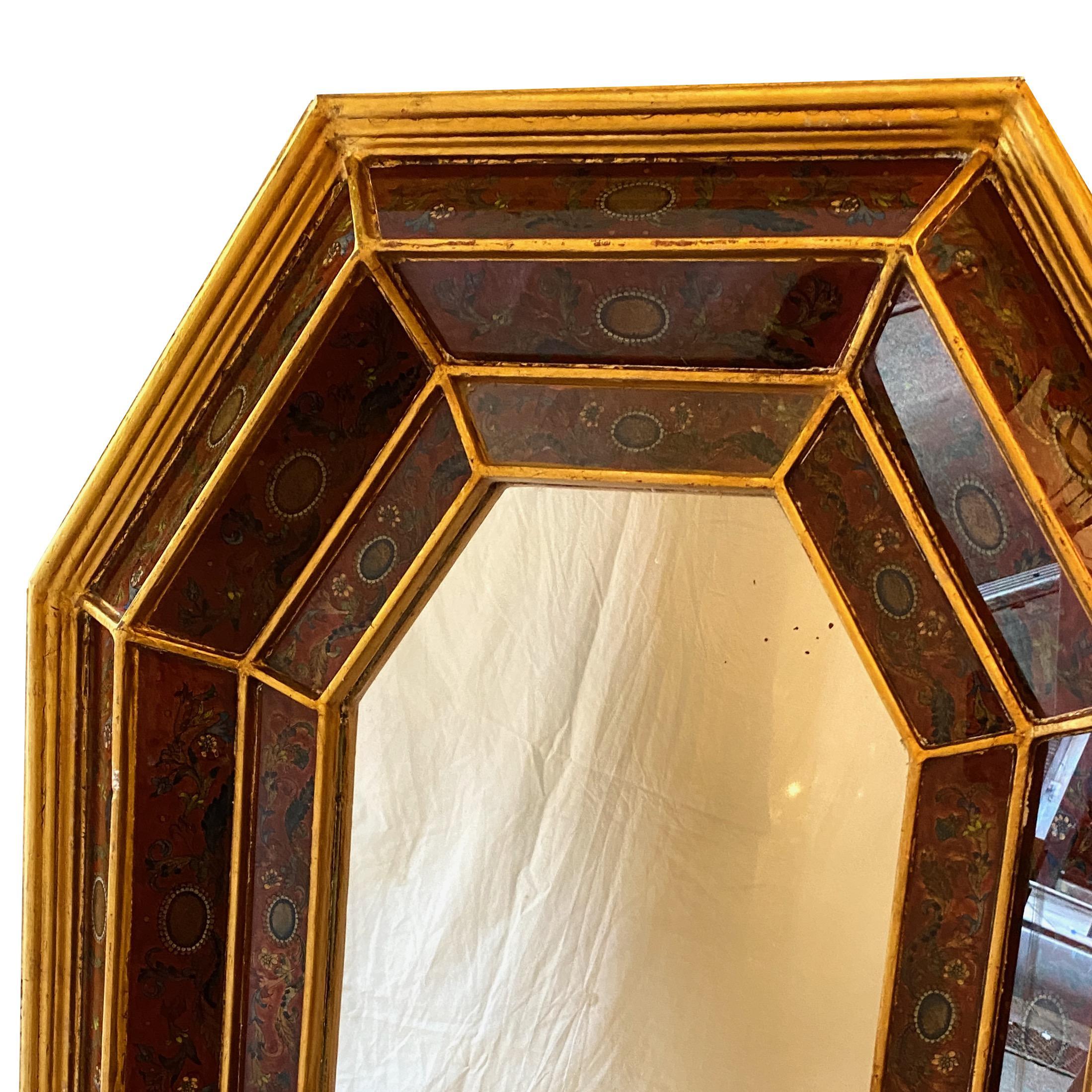 A large circa 1940’s Italian reverse-painted glass mirror with gilt frame.

Measurements:
Height: 45?
Width: 35?
Depth: 4?