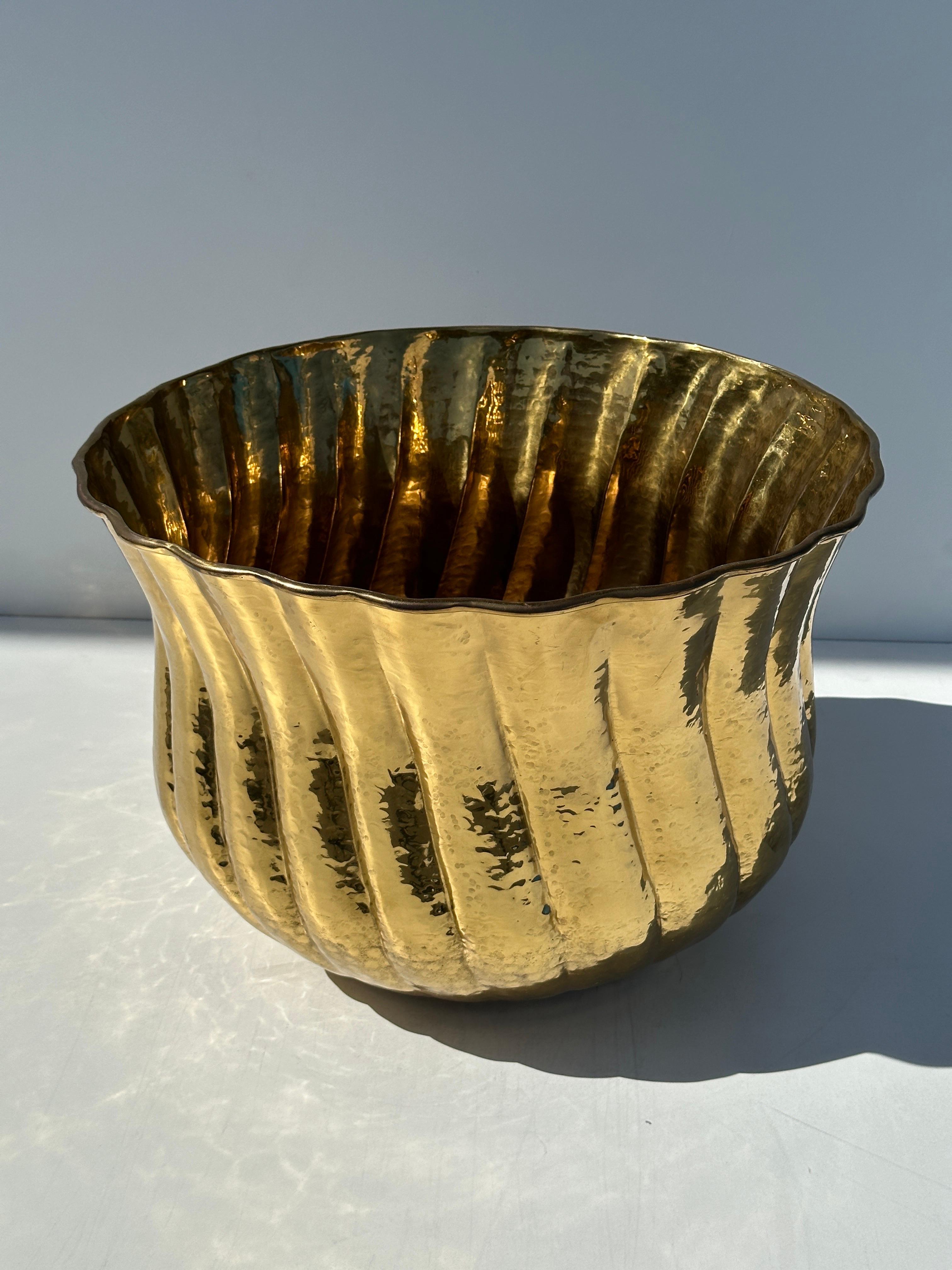 Large hand hammered ribbed brass planter.