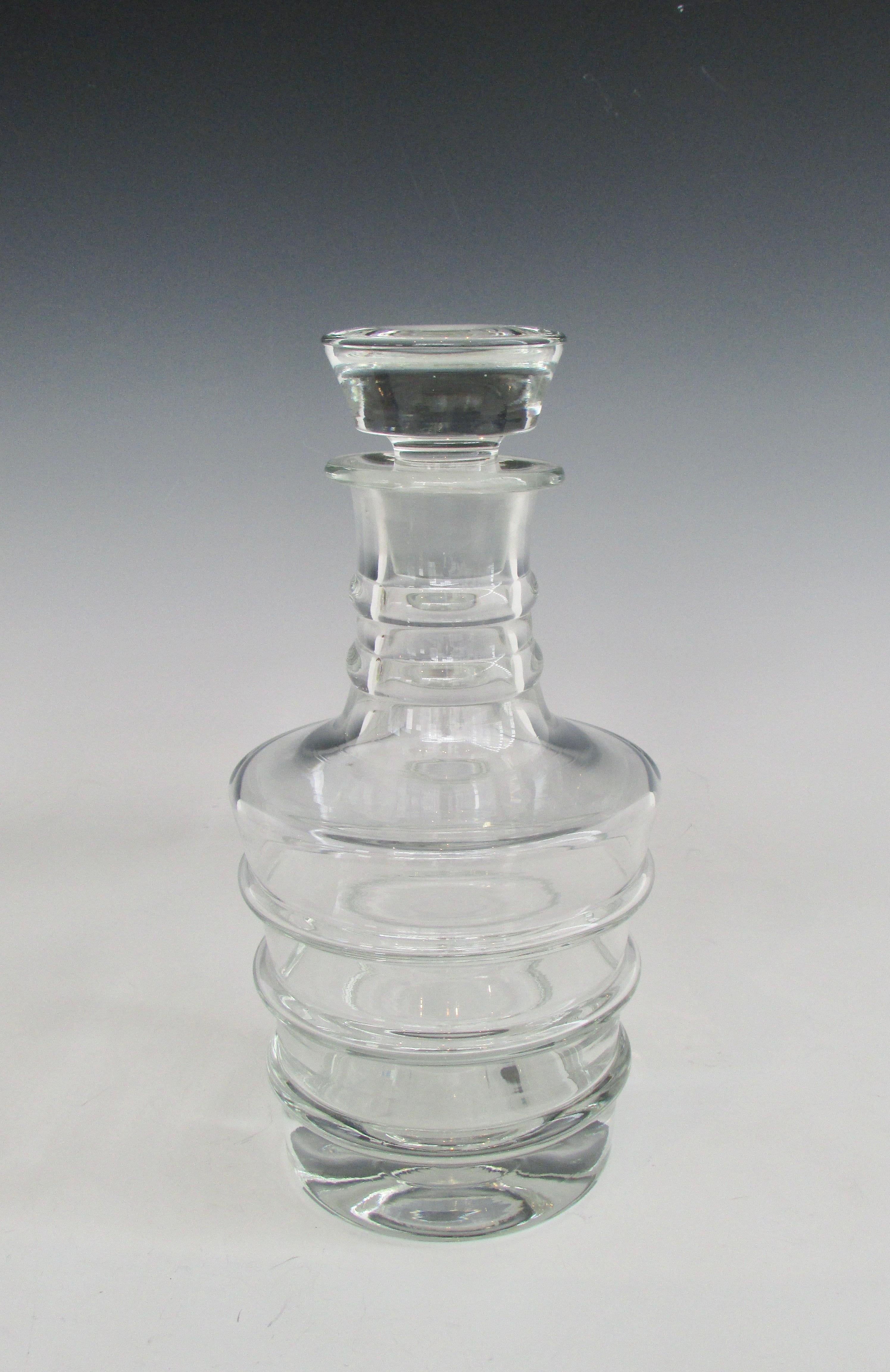 Large substantial clear glass decanter with stopper.