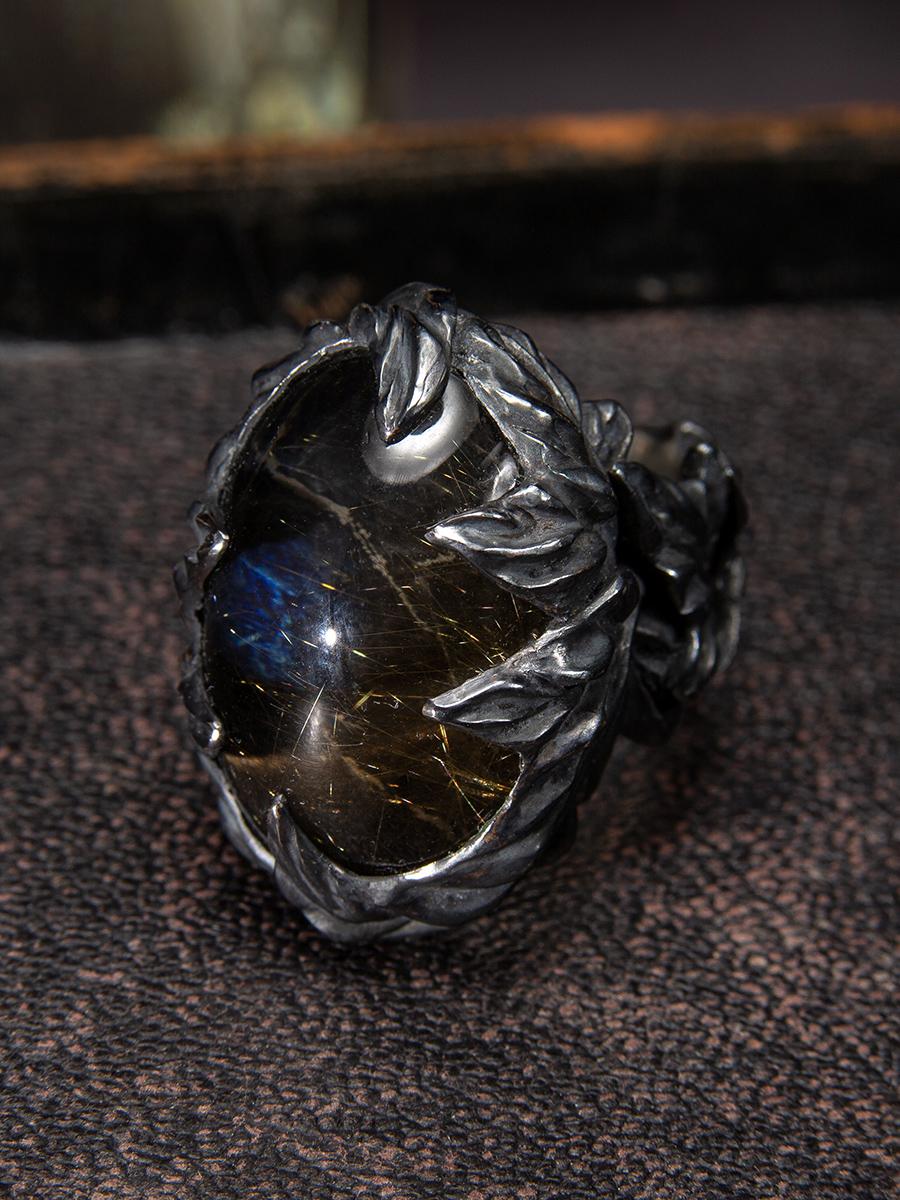 Large ring with a doublet of Rutilated Quartz and Labradorite in black patinated silver
cabochon measurements - 0.78 x 1.18 in / 20 x 30 mm
cabochon weight - 35 carats
ring size - 8.5 US
ring weight - 47 grams


We ship our jewelry worldwide – for