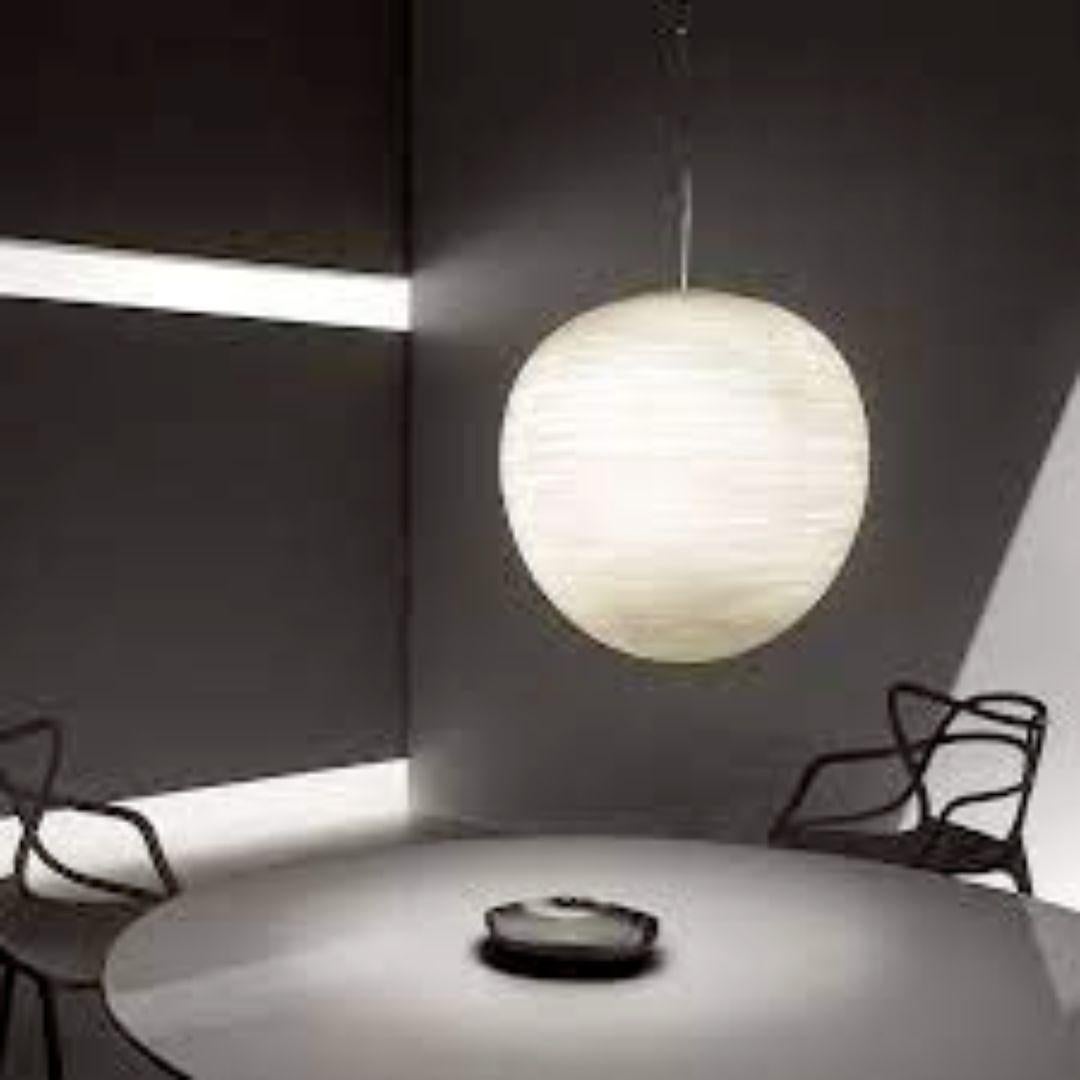 Large ‘Rituals XL’ blown opaline glass suspension lamp in white for Foscarini.

Designed by Ludovica + Roberto Palomba and produced by Foscarini, the Italian lighting firm founded in Venice on the legendary island of Murano, where generations of