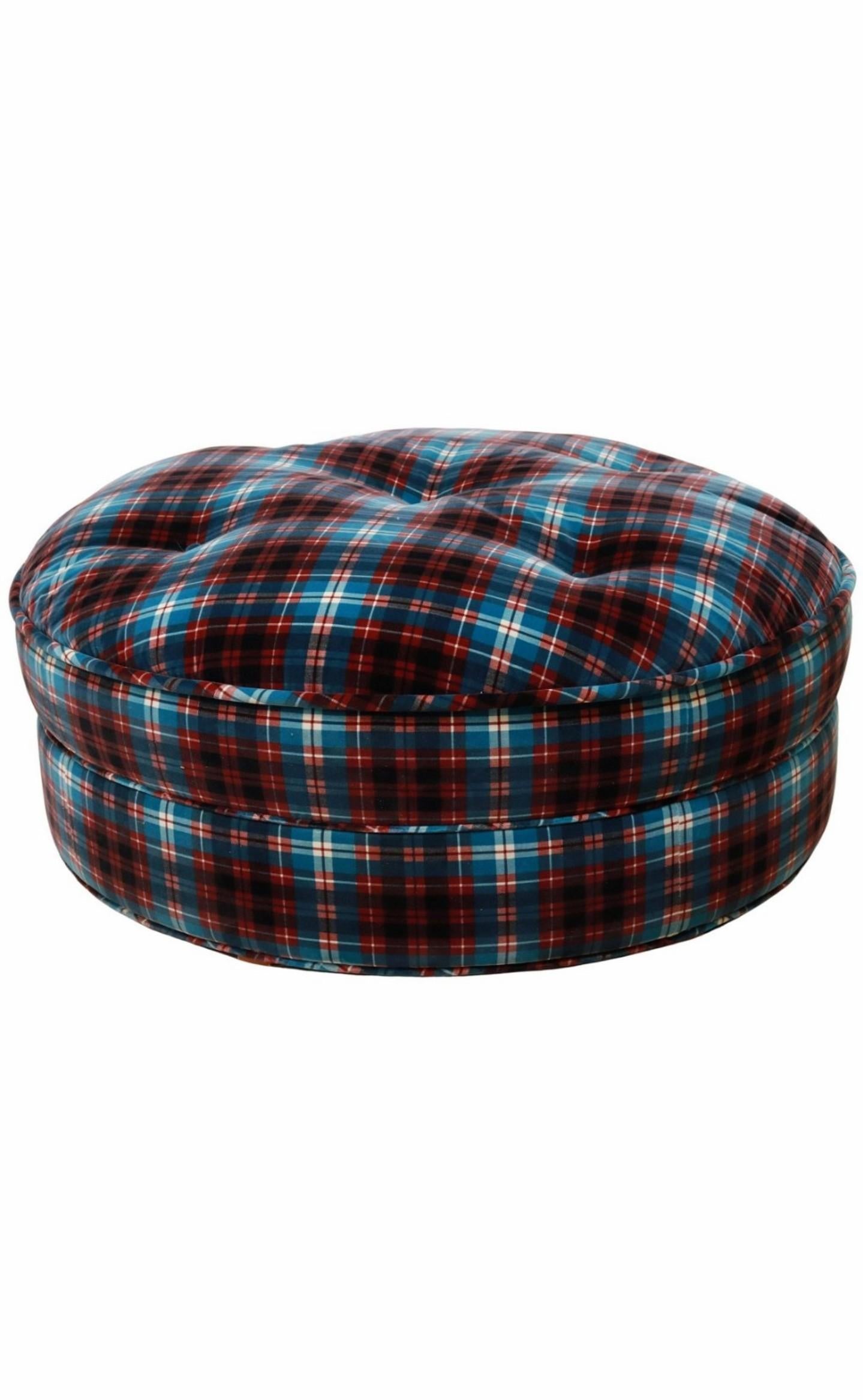 Add elegant rustic warmth, classic comfort, and unfussy sophistication to any space with this contemporary round ottoman, attributed to fine quality luxury furniture producer Roche Bobois, finished in distinctive 