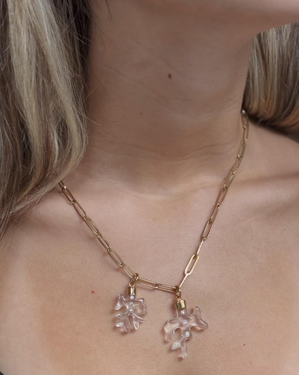 Rock Crystal and Diamond Coral Pendant 

Rock Crystal, Diamonds, 14k Gold

These are exquisitely carved coral shapes made from rock crystal. With three 2mm diamonds bezeled in 14k gold. To top it off, a custom 14k gold cap and ring bail. 

Every