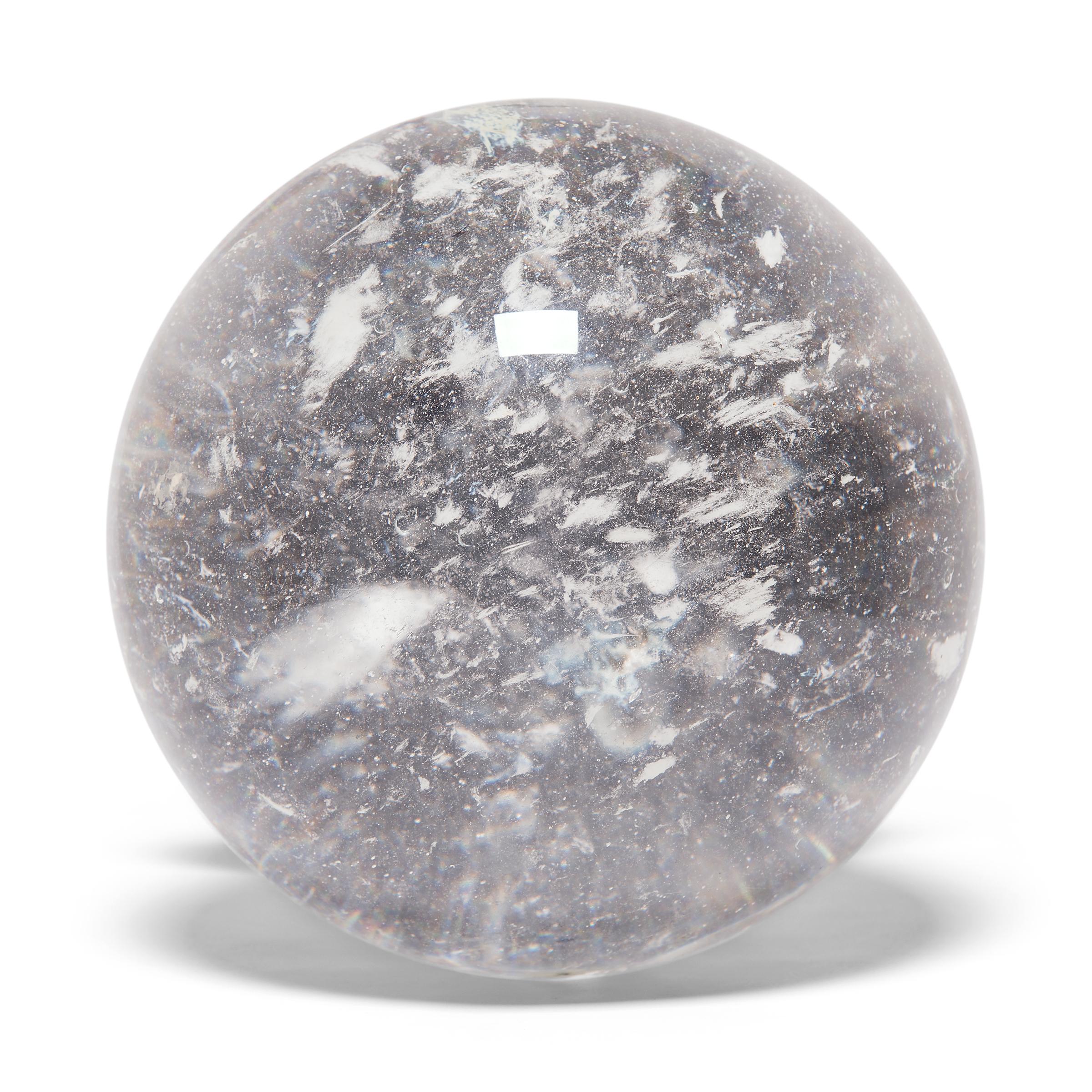 Gem lore is endless, and every culture has its own beliefs about specific stones tied to cultural history, geography, and spiritual practices. In China, some practitioners of feng shui value clear quartz, like this beautiful crystal ball, for its