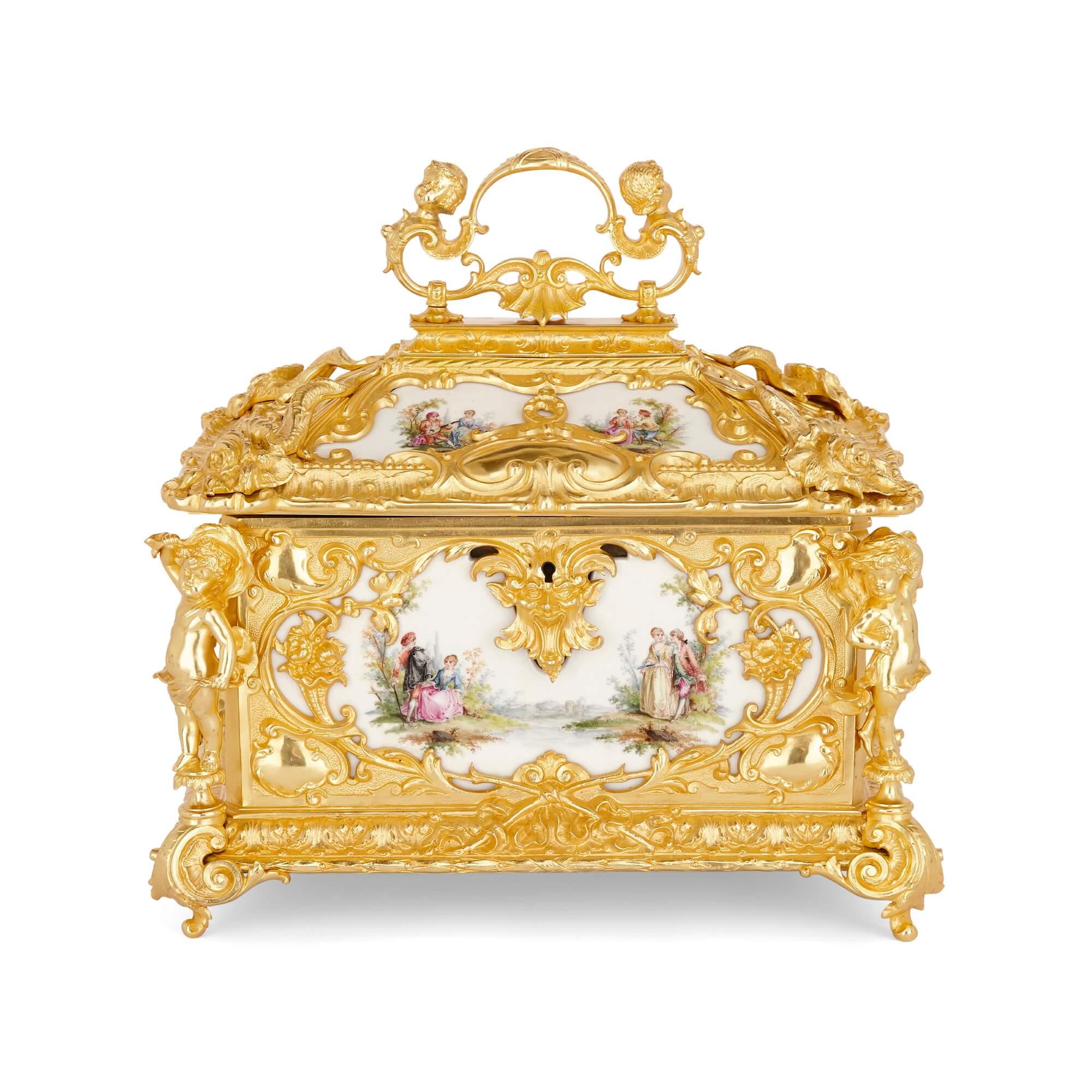 Large Rococo style gilt bronze and porcelain decorative casket.
German, late 19th Century
Measures: height 37cm, width 37cm, depth 27cm
Open: height 43cm, width 37cm, depth 42cm

This splendid German gilt bronze casket is designed in the Rococo