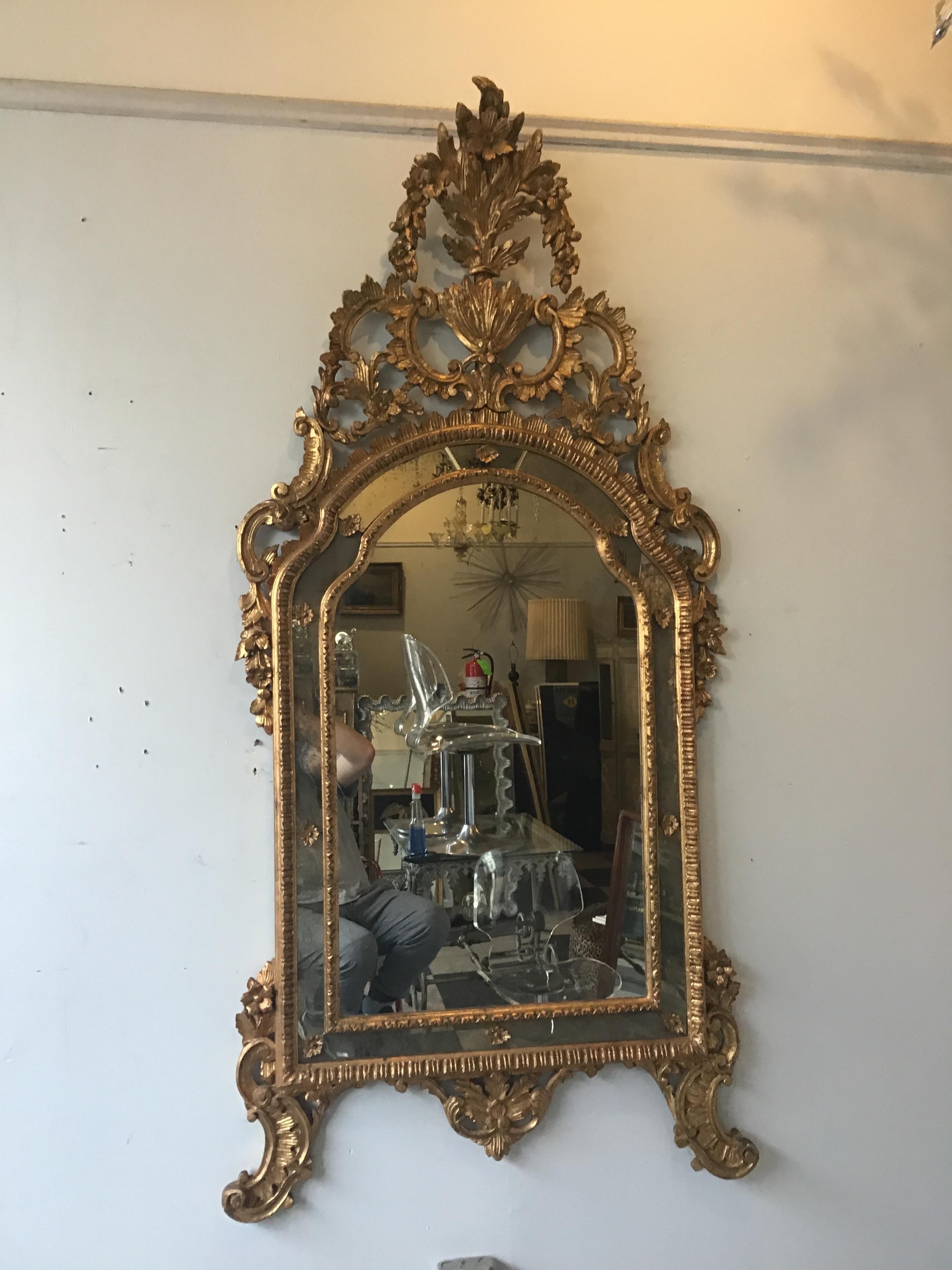 Large Italian carved wood gilt mirror.