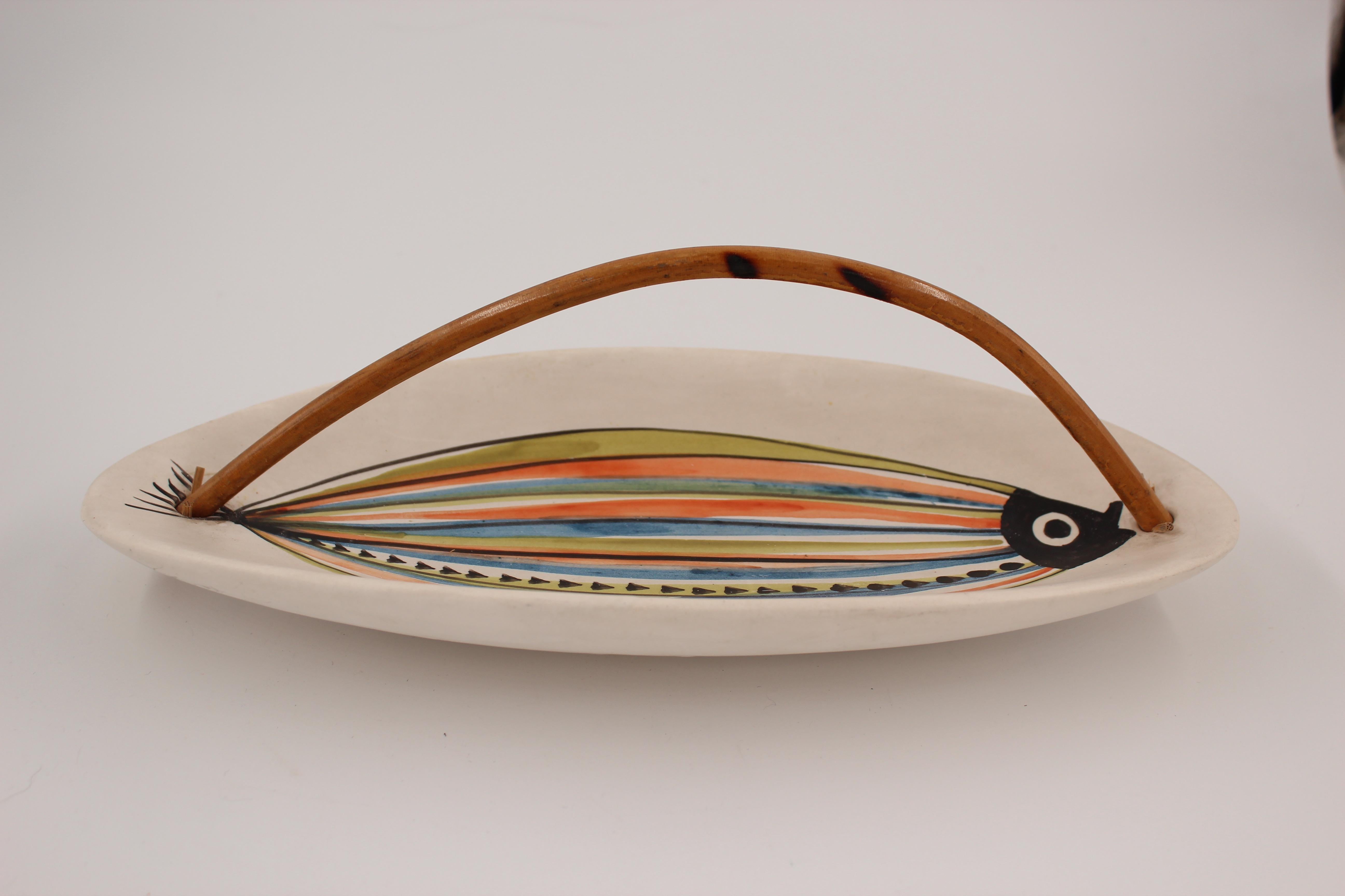 Roger Capron (1922-2006) decorative dish with bamboo handle
Blue/orange/green stylized fish
Signed Capron, Vallauris, 1950s.