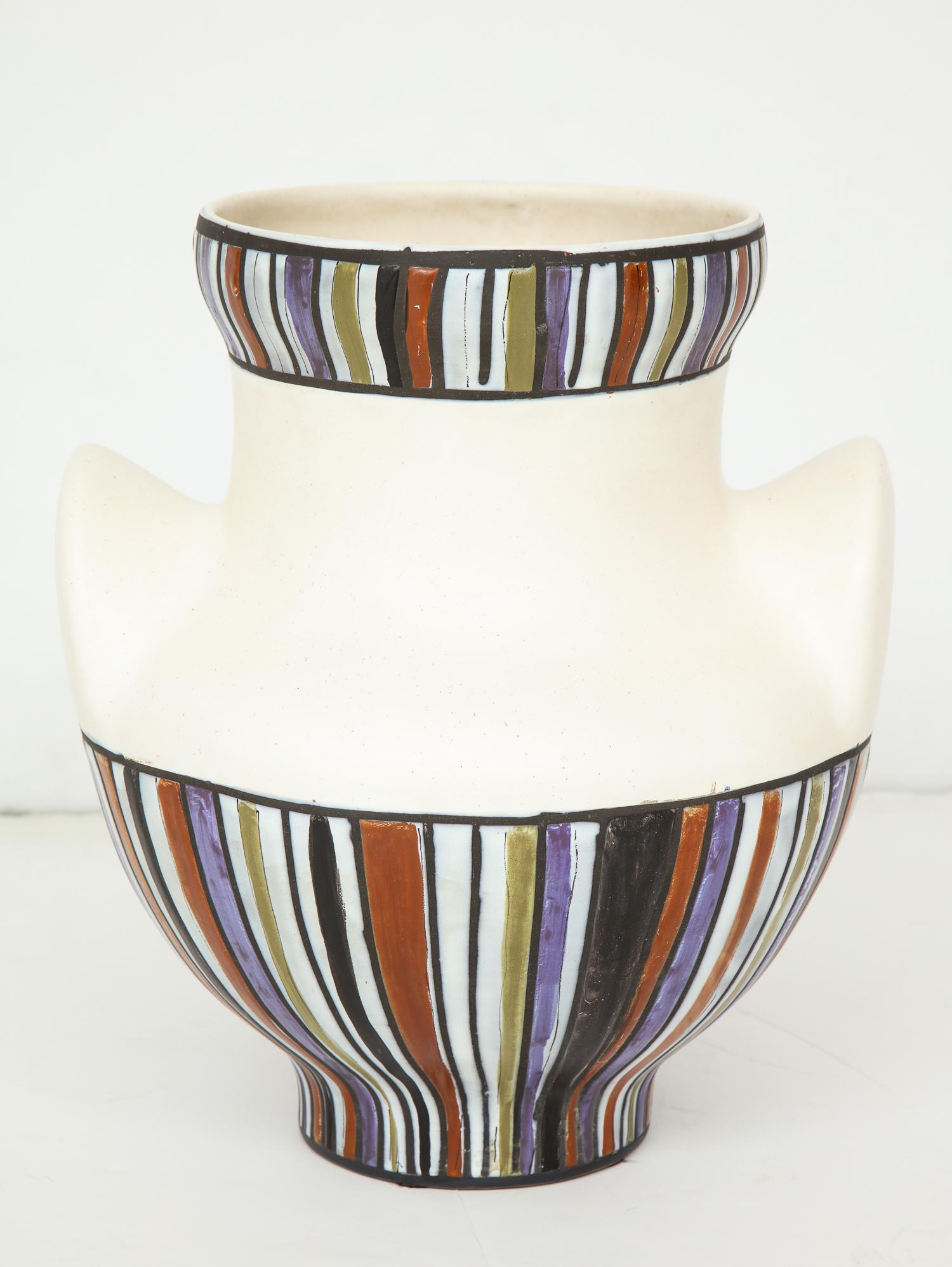 Ceramic vase form with ears (oreilles) and applied polychrome enamel paint, by Vallauris master Roger Capron. The largest, and scarcest, of three sizes. Vividly colored and fluidly drawn pattern. Signed “Capron Vallauris” to base