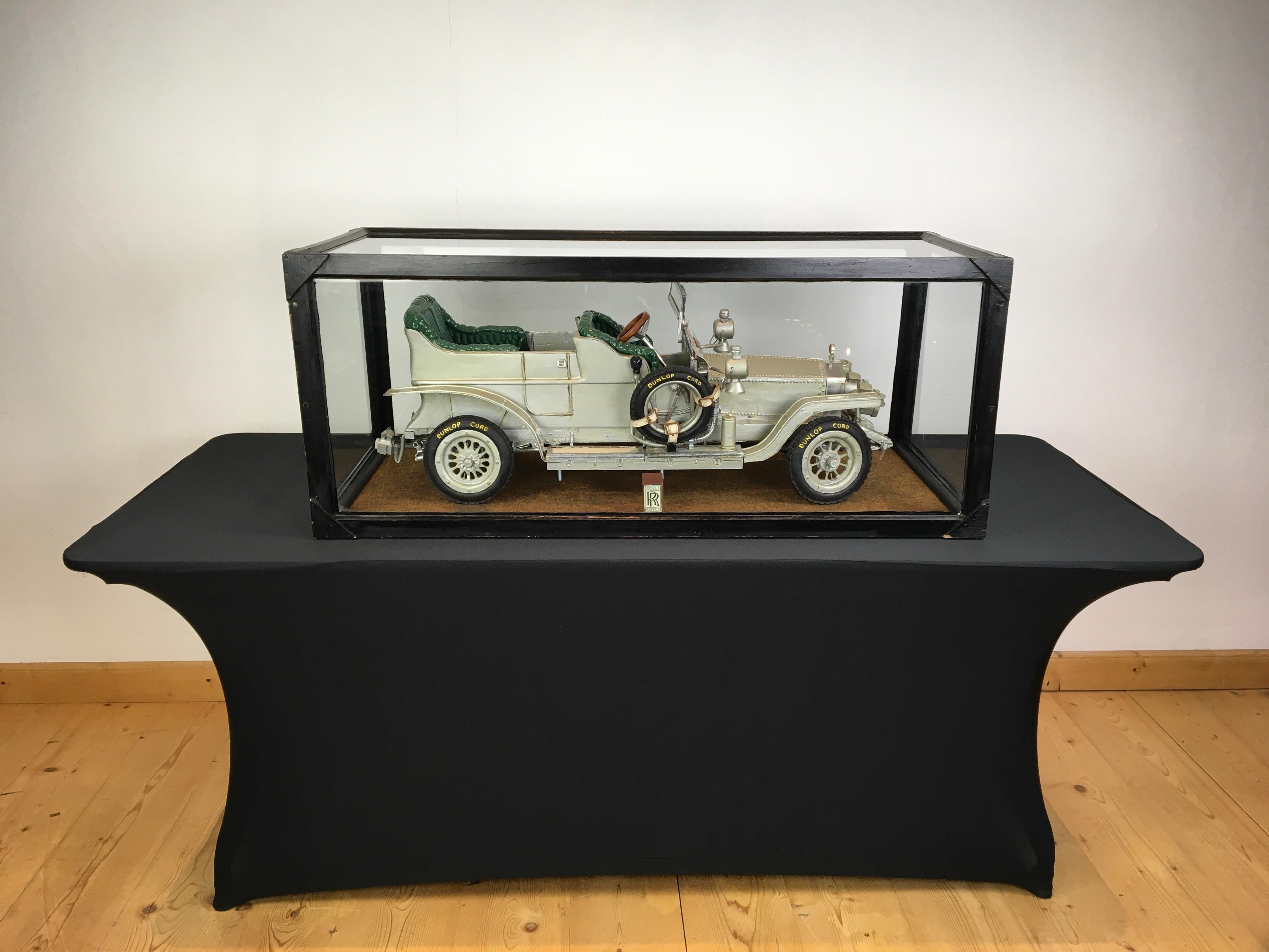 Large Rolls-Royce silver ghost model in showcase. 
This large one of a kind handcrafted scale model of the Open Tourer is an eyecatcher in your interior or office by his size ! 
The showcase is 45 Inch - 113,5 cm long and the RR car is 37 Inch -