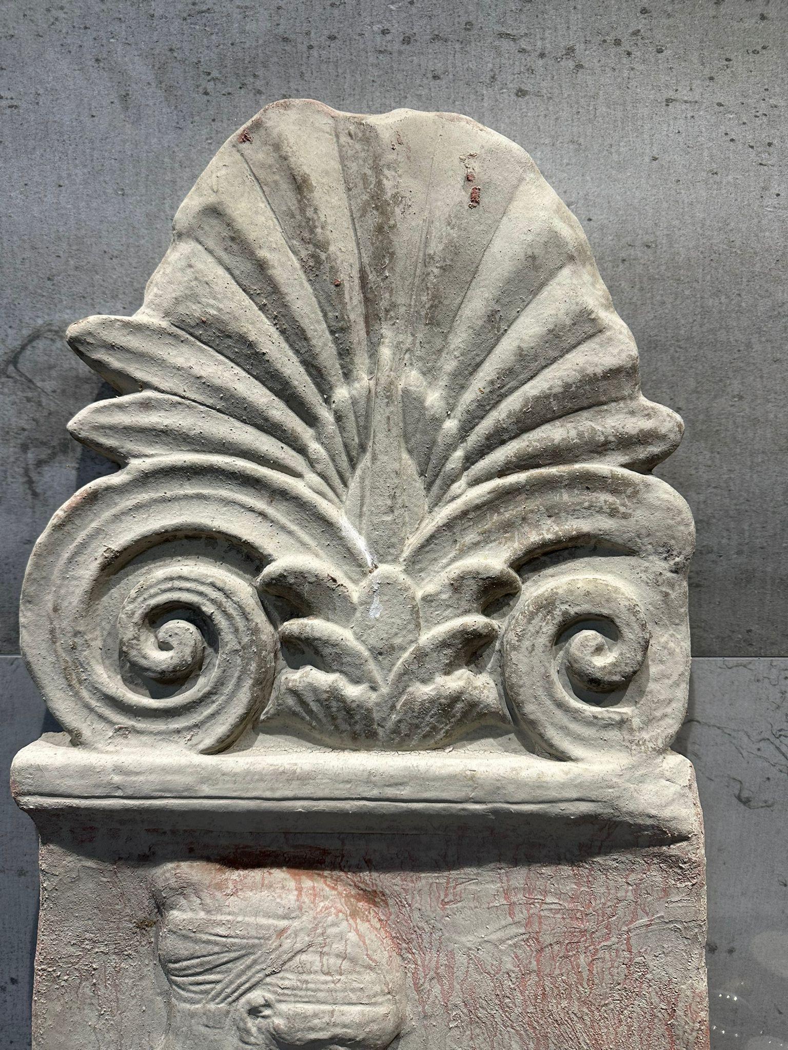 Large Roman terracotta antefix early 20th century
Italy
Measures: height 83cm
width 39cms
thickness 4cm
weight 8kg
material terracotta
Good conditions.
