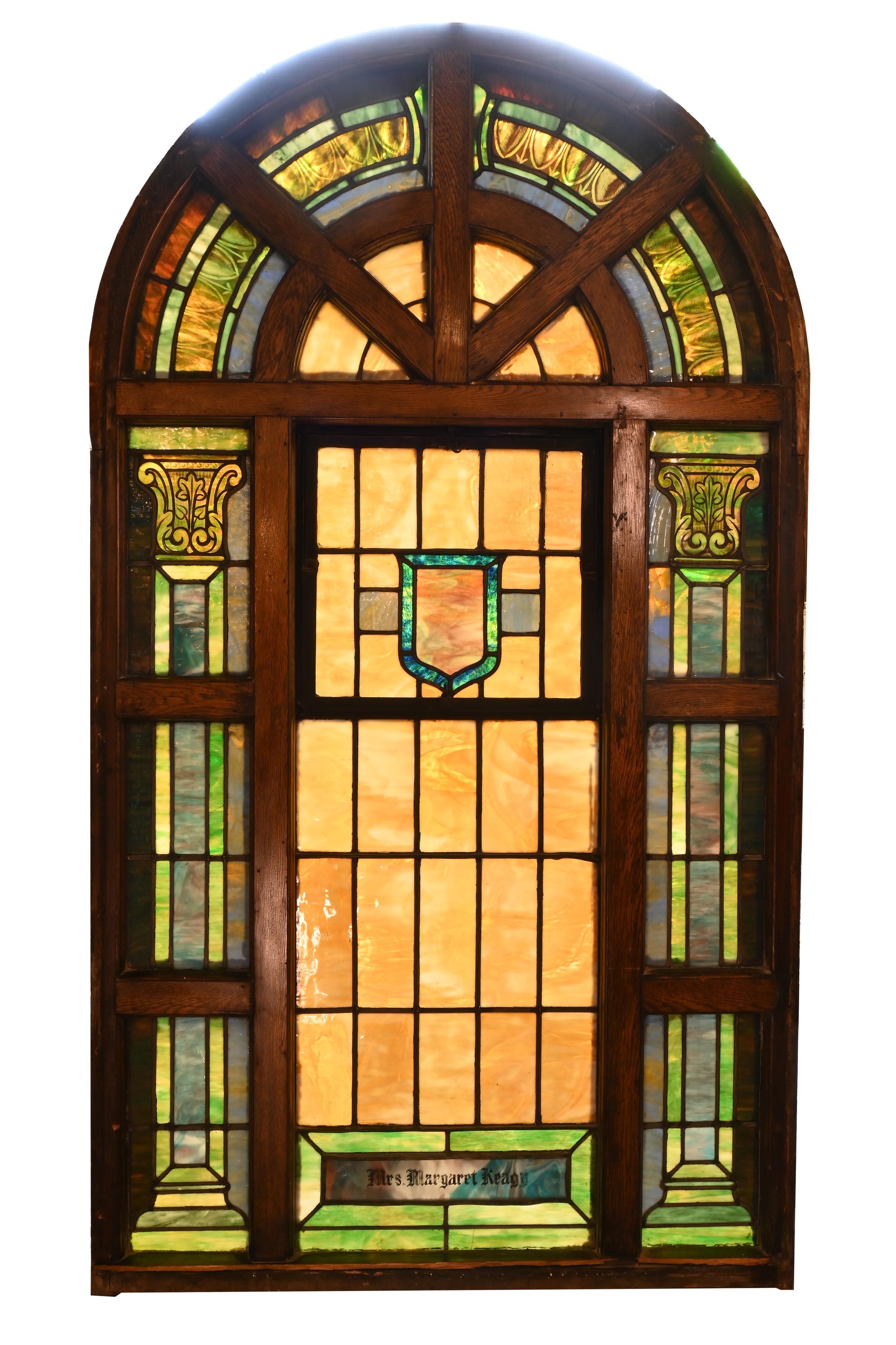 Amazing arch topped windows in great condition. Each window has a 24” tall arch top with egg & dart tops on the eight divided sections over a 22” by 55” center panel. Flanking columns in three sections finishing these large scale windows. Colors