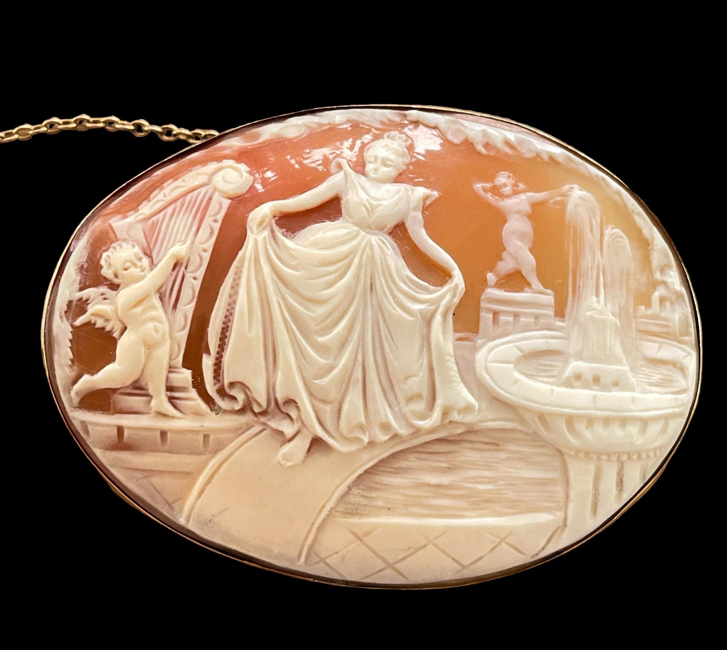This Cameo is really something special.  
It is hand carved Sardonyx Shell (Conch shell) and depicts a young lady, dancing through a garden to the sound of a harp and the trickle of a water fountain.  I think it is quite magical and I’ve never seen