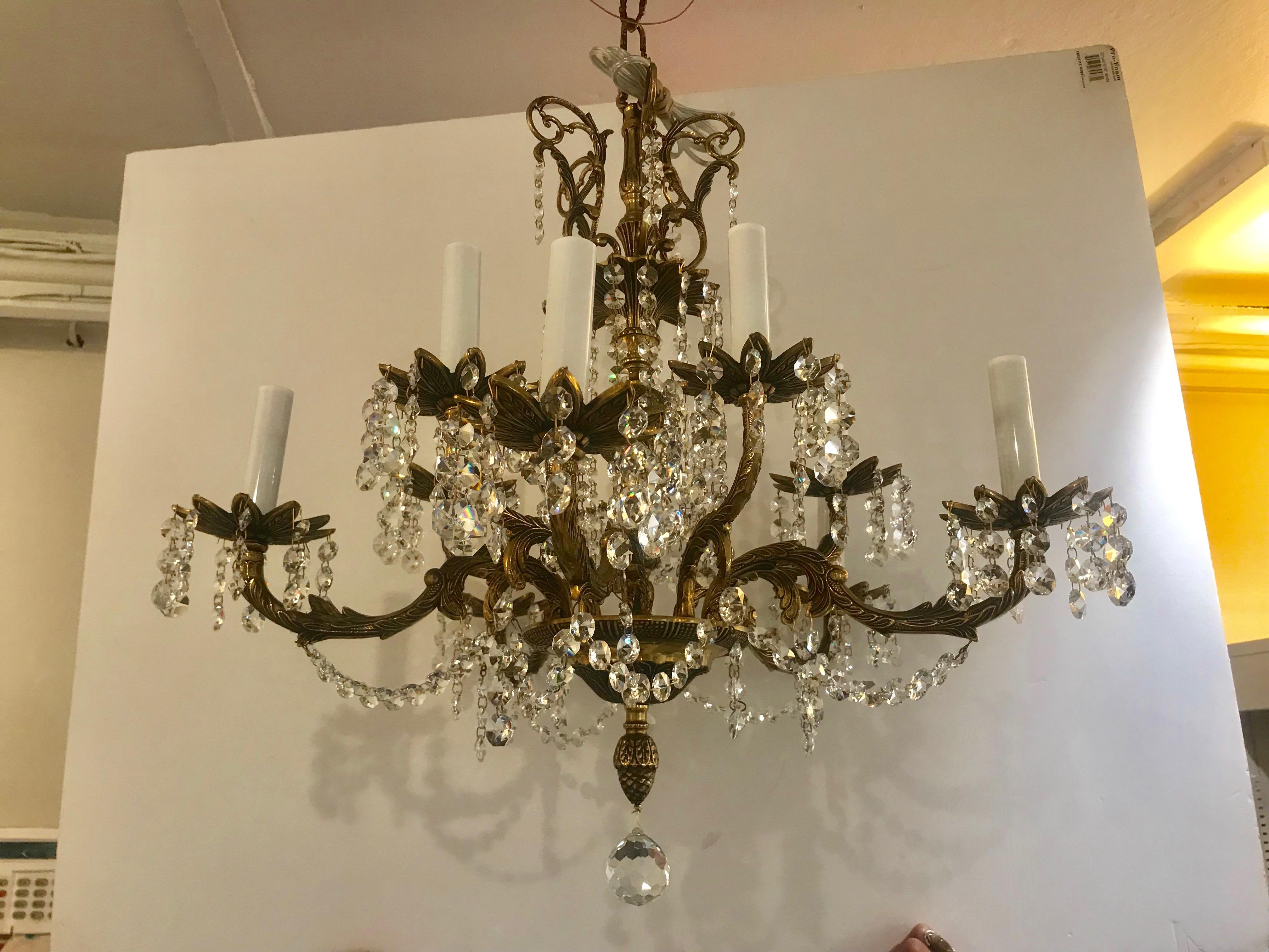 Large crystal 10-arm Spanish vintage brass chandelier adorned with crystals.
Newly reworked and cleaned.
 