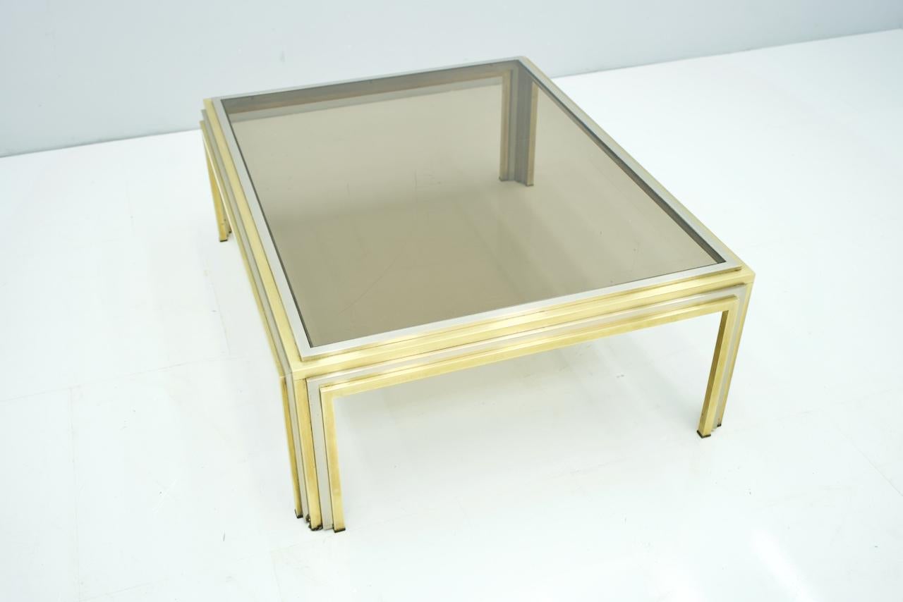 Large Romeo Rega Bi color coffee table brass chrome and glass, 1970s.

Good to very good condition.
Details

Creator: Romeo Rega (Designer)
Period: 1970s
Color: silver, gold
Style: Hollywood Regency
Place of Origin: Europe
Dimensions: Height: 16.15