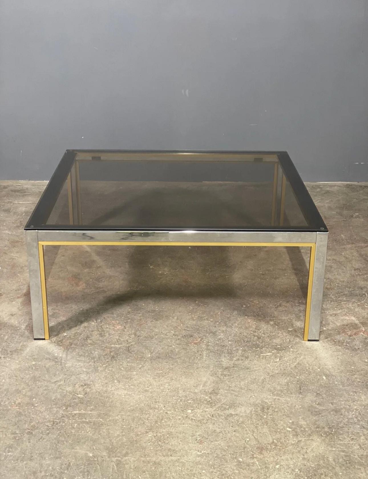 Romeo Raga large coffee table dating to the 1970’s, it has a chrome frame with brass trim and smoked glass top which is removable. In very good overall condition with very little wear.
