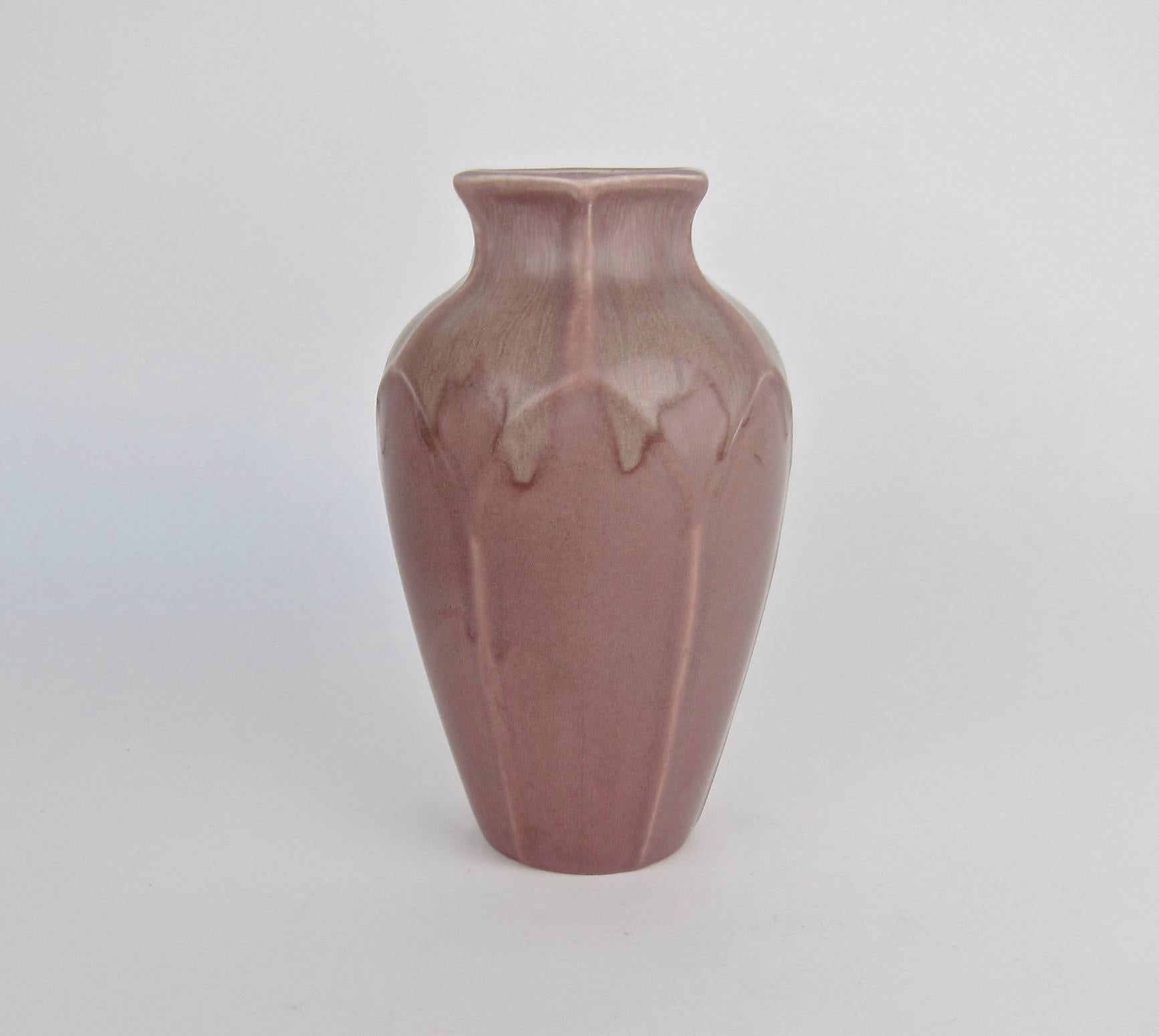 A large Rookwood Pottery production vase made during the Arts and Crafts period in 1921. The American art pottery vase is a substantial piece with an hexagonal mouth and molded points encircling the shoulder connecting to ridges down the body. The