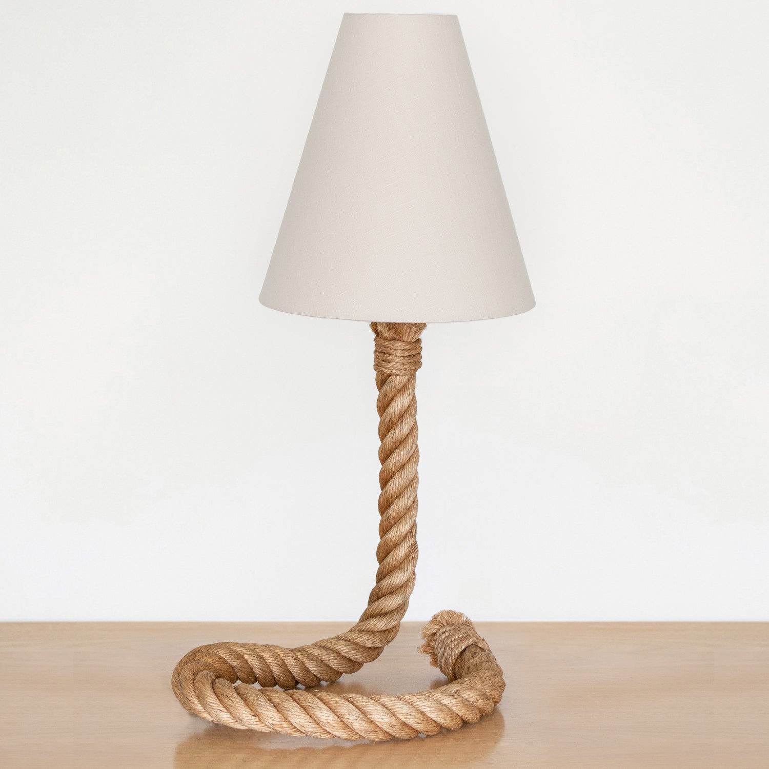 Incredible large rope table lamp by Adrien Audoux & Frida Minet, France, 1960s. Beautiful thick twisted rope with curved circular base and sculptural stem holding shade. New large linen tapered shade and newly re-wired. Two available and sold