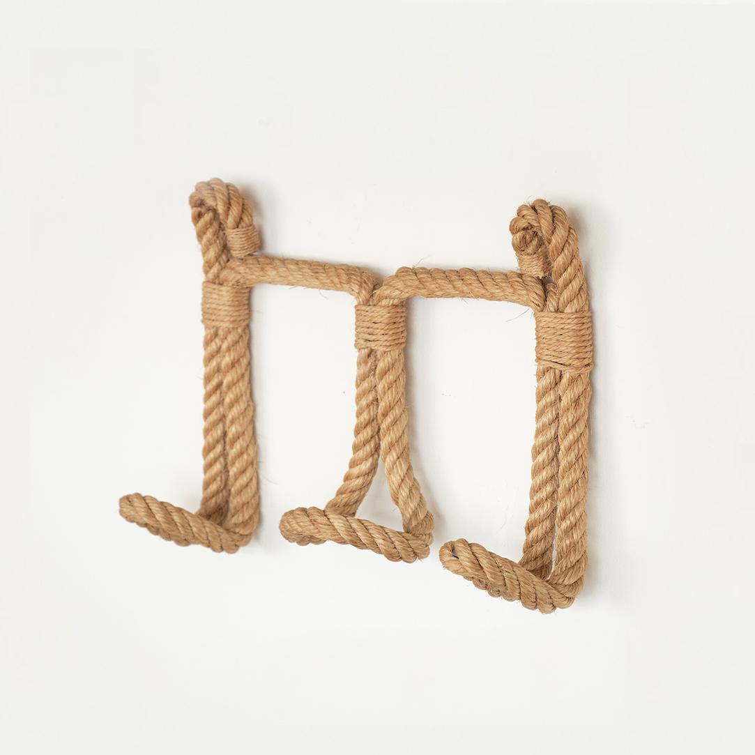 Beautiful French 1950's wall hook made of thick twisted rope and twine by Audoux-Minet. Three tongue shaped hooks, perfect to hold hats or coats.