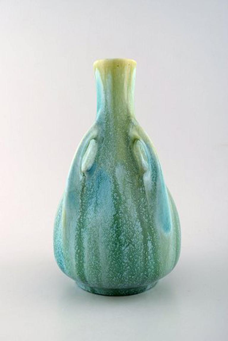 Large Rorstrand Art Nouveau crackled/craquelé vase in faience, circa 1900.
Beautiful green blue glaze.
In perfect condition, factory first.
Measures: 24 cm x 14.5 cm.