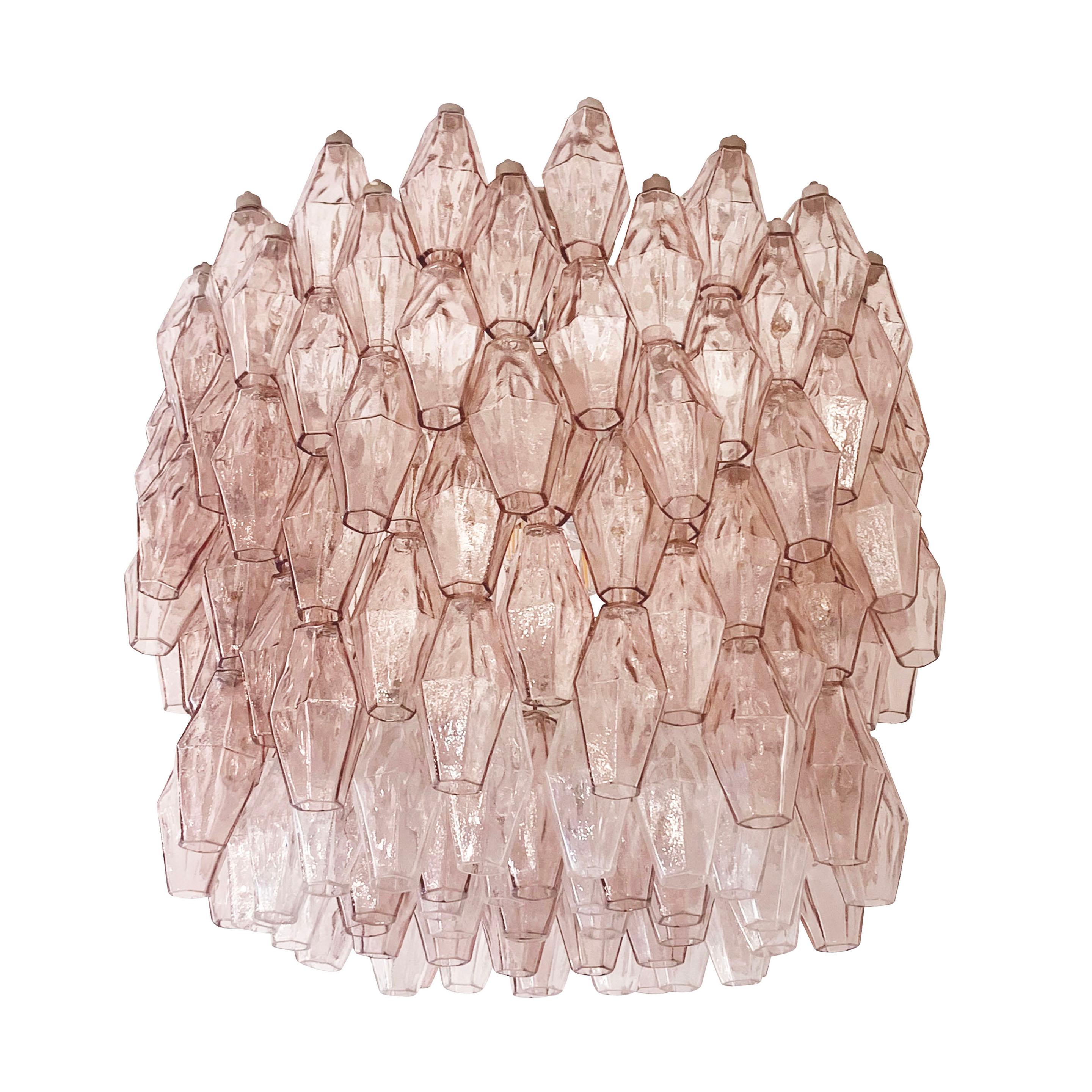 Large Italian Mid-Century chandelier by Venini with dozens of rose colored handblown polyhedral Murano glasses. White frame with manufacturer’s mark still present. Nickel canopy.

Condition: Excellent vintage condition, minor wear and chips