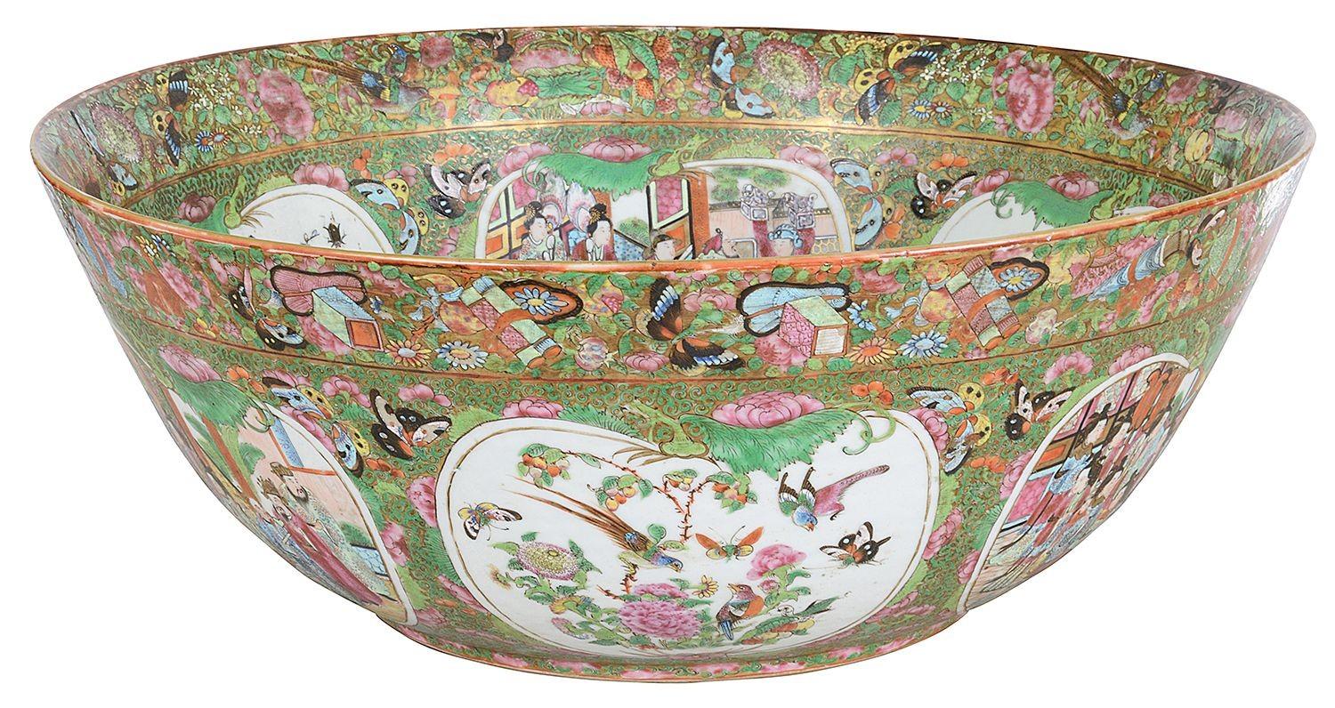 The 19th-century Chinese Cantonese / Rose Medallion bowl is a stunning example of Qing dynasty porcelain artistry. Characterized by its vibrant, multi-colored floral patterns, the bowl features intricate hand-painted scenes depicting courtly life,